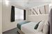 Guest room with one queen bed and two single beds