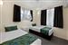 Guest room with one queen bed and two single beds