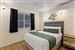 Guest room with one queen bed and one single bed