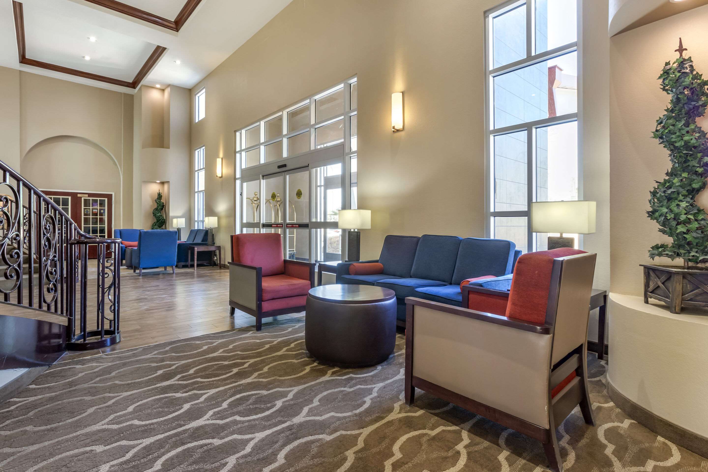 Spacious lobby with sitting area | Comfort Suites Phoenix Airport