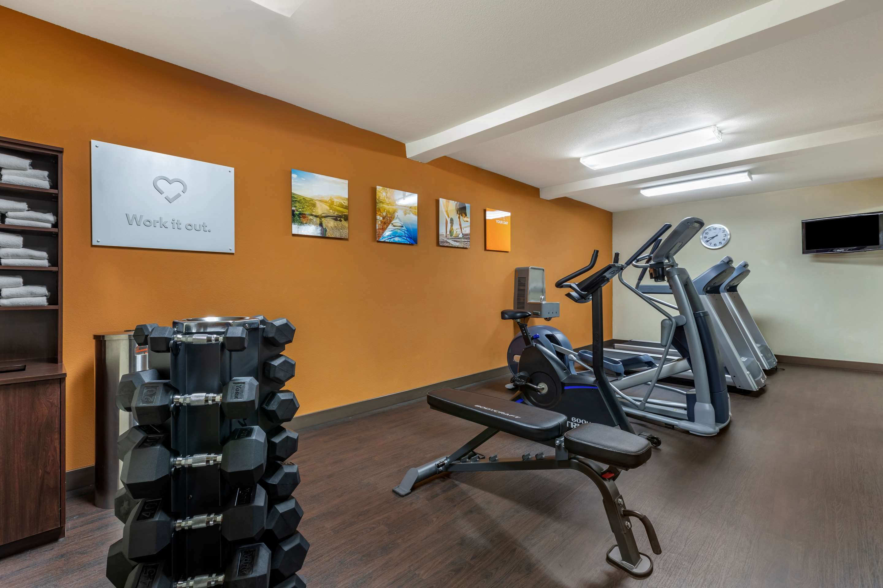 Exercise room with cardio equipment and weights | Comfort Suites Visalia Convention Center