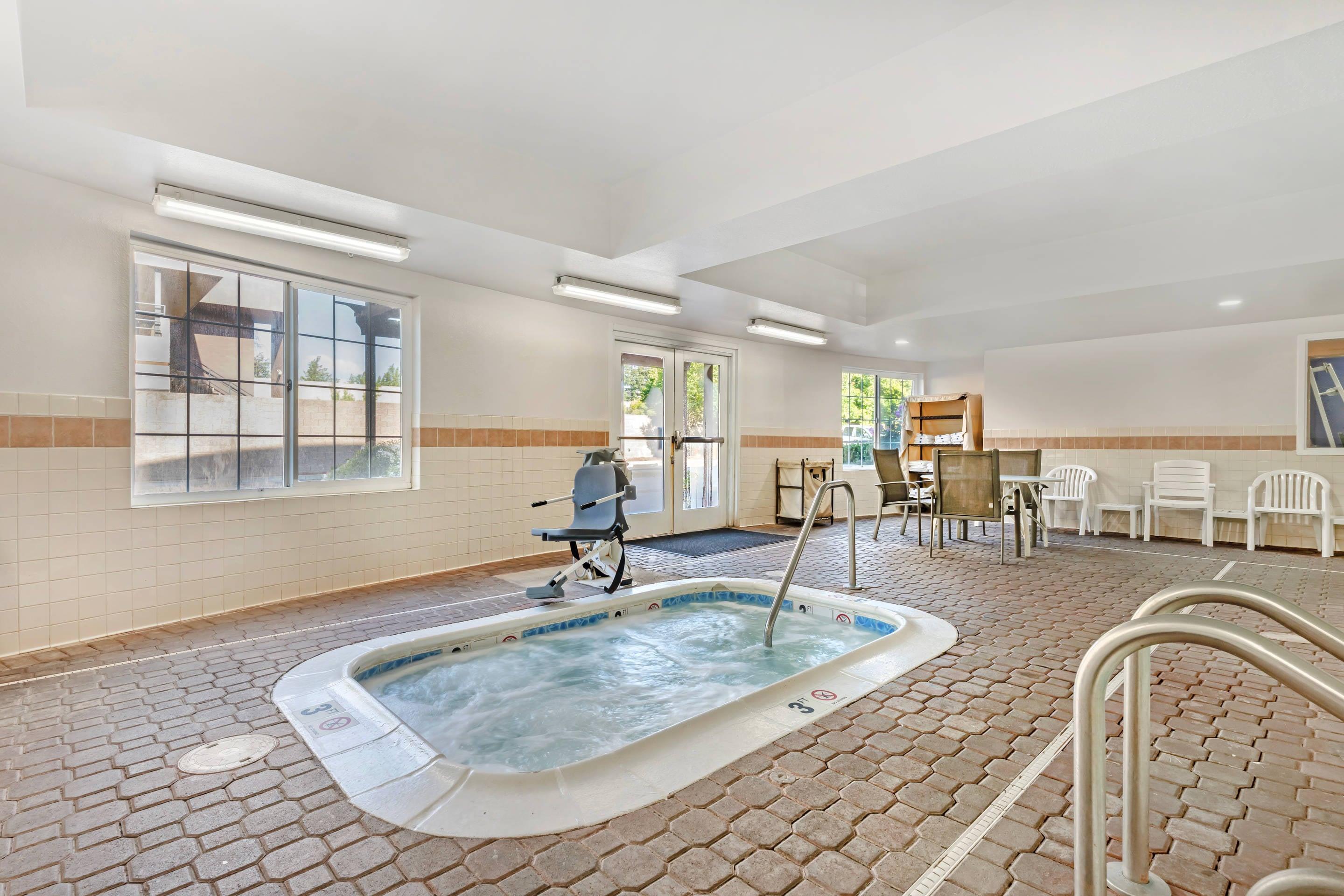 Relax in the hot tub | Comfort Inn & Suites Sacramento - University Area