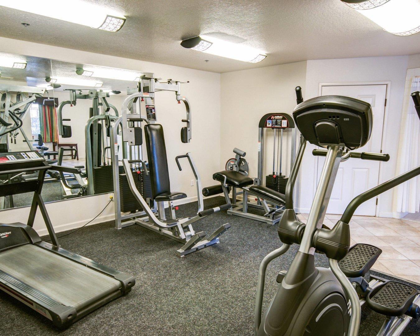 Exercise room with cardio equipment and weights | Comfort Inn Redding
