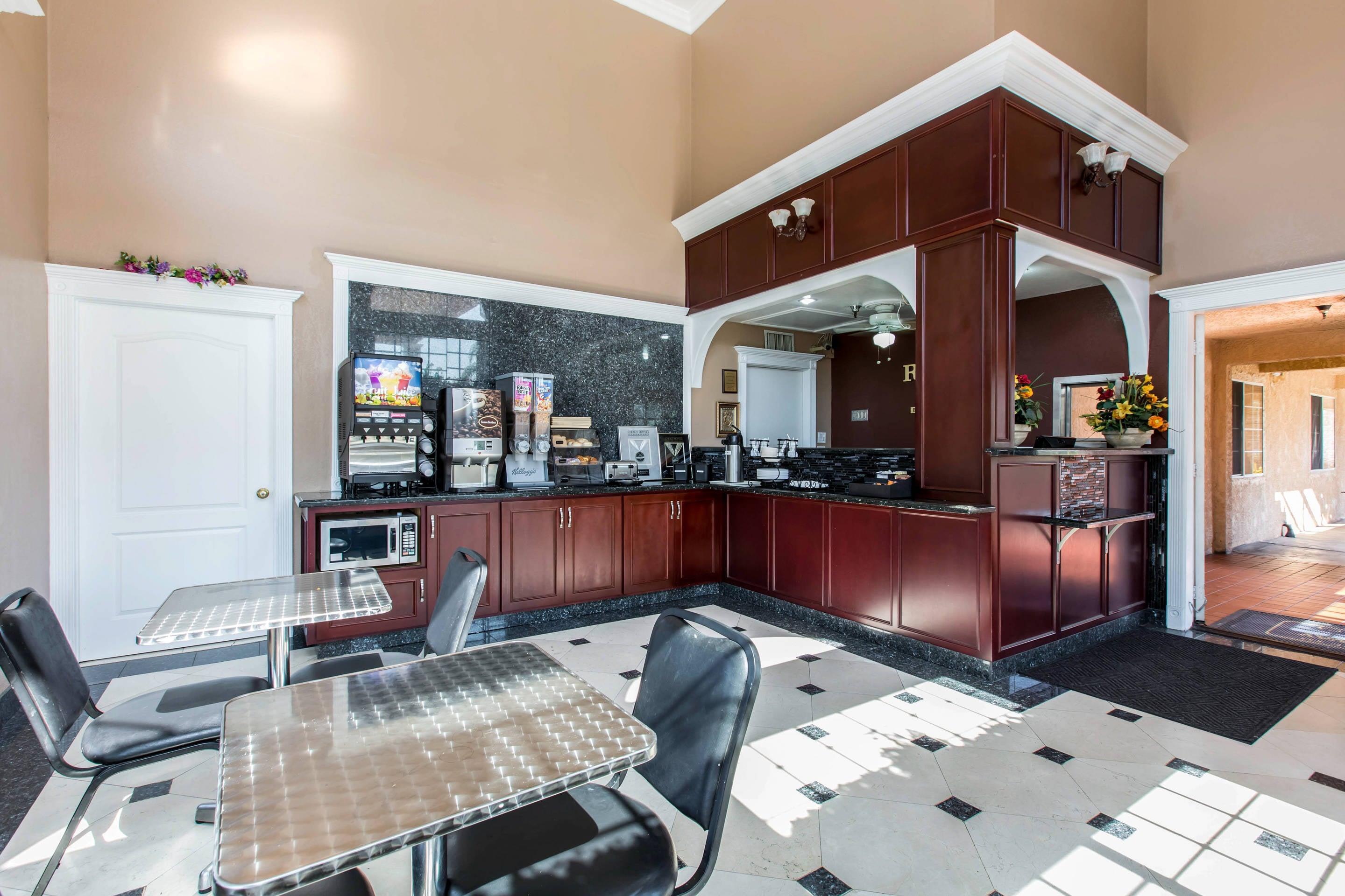 Enjoy breakfast in this seating area | Rodeway Inn Cypress - Buena Park