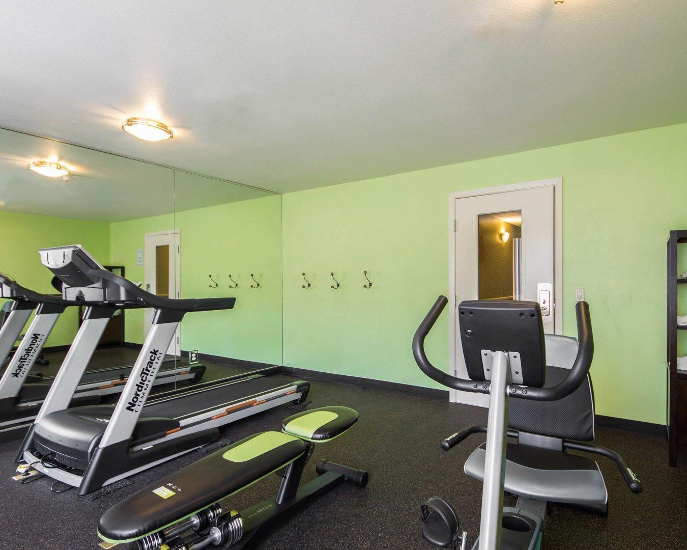 Fitness center with cardio equipment and weights | Hotel Med Park, Ascend Hotel Collection