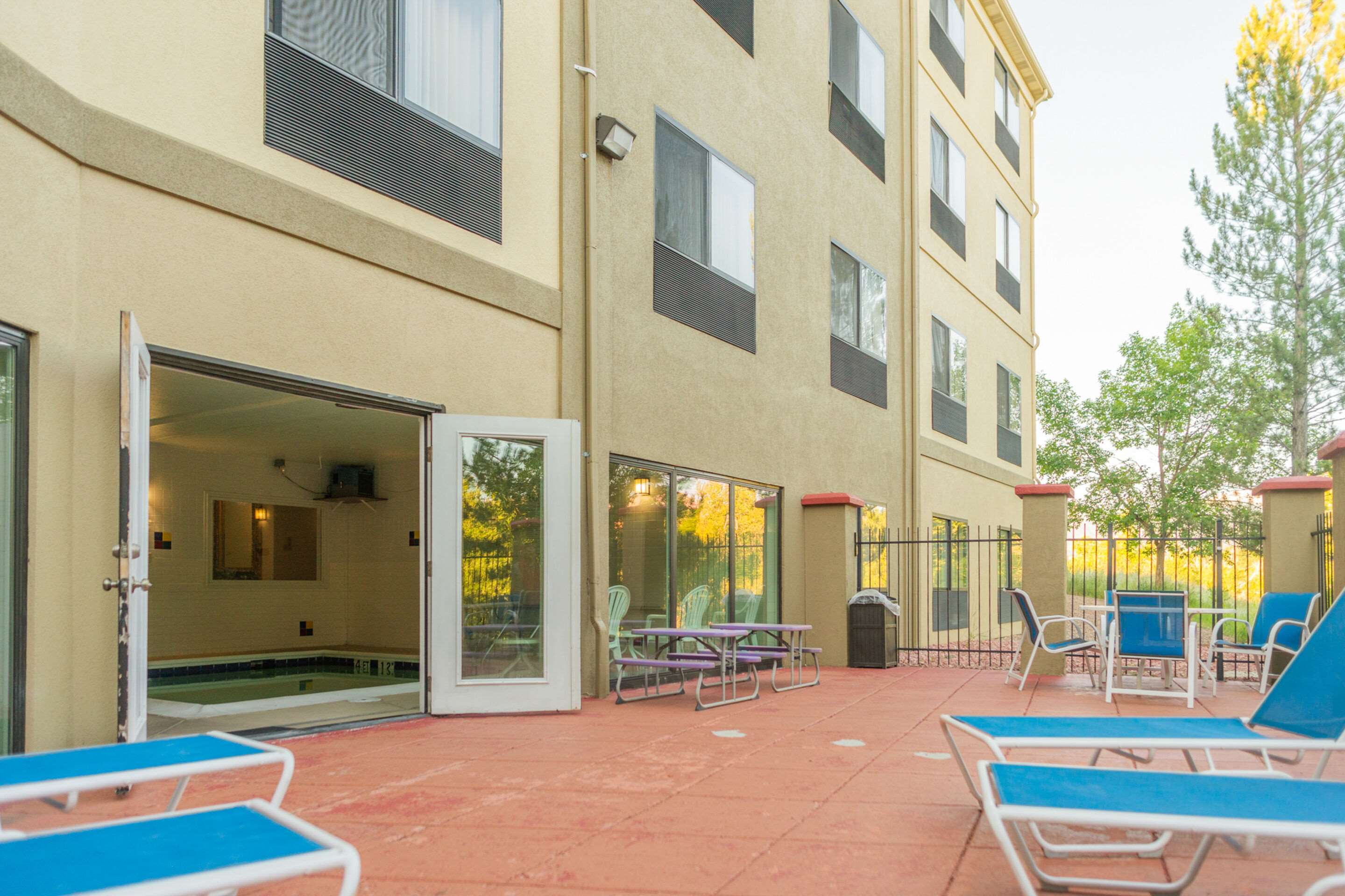 Relax by the pool | Comfort Inn North - Air Force Academy Area