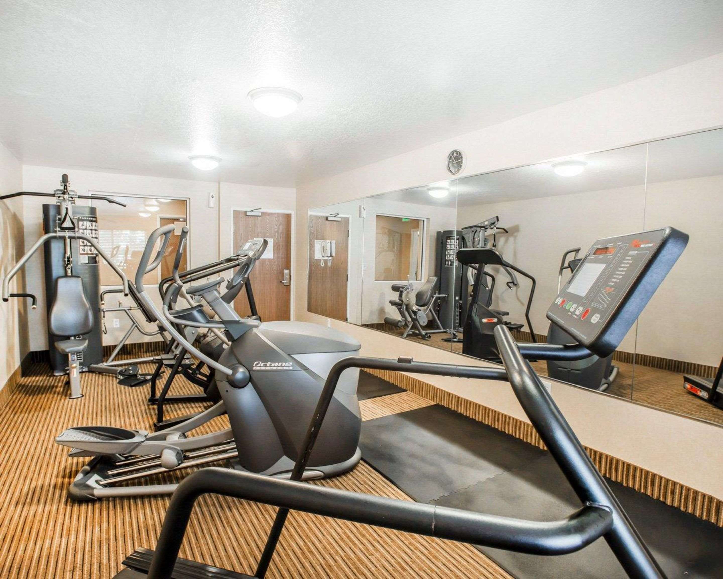 Fitness center with cardio equipment and weights | Quality Inn & Suites Denver International Airport