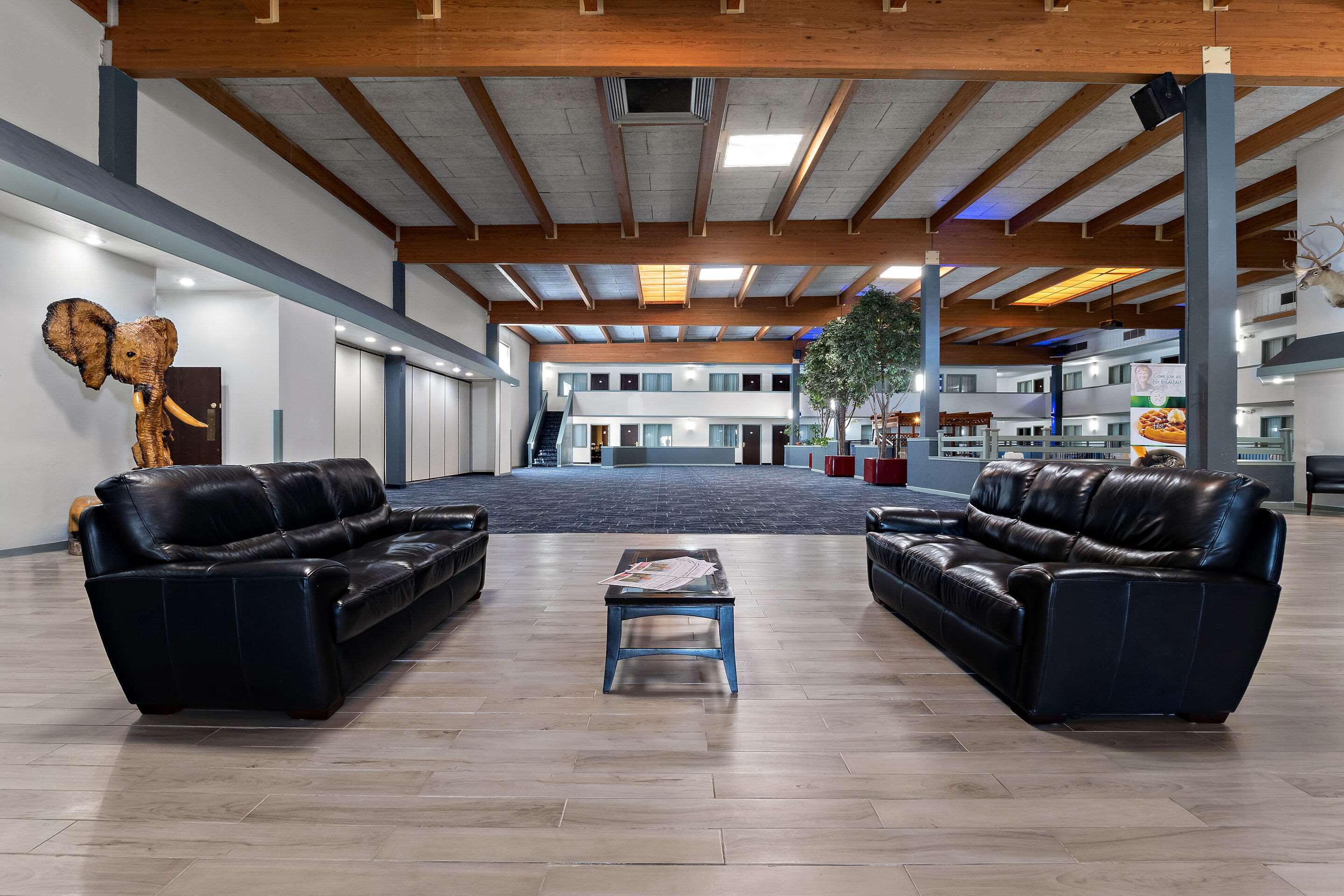 Spacious lobby with sitting area | Quality Inn & Suites