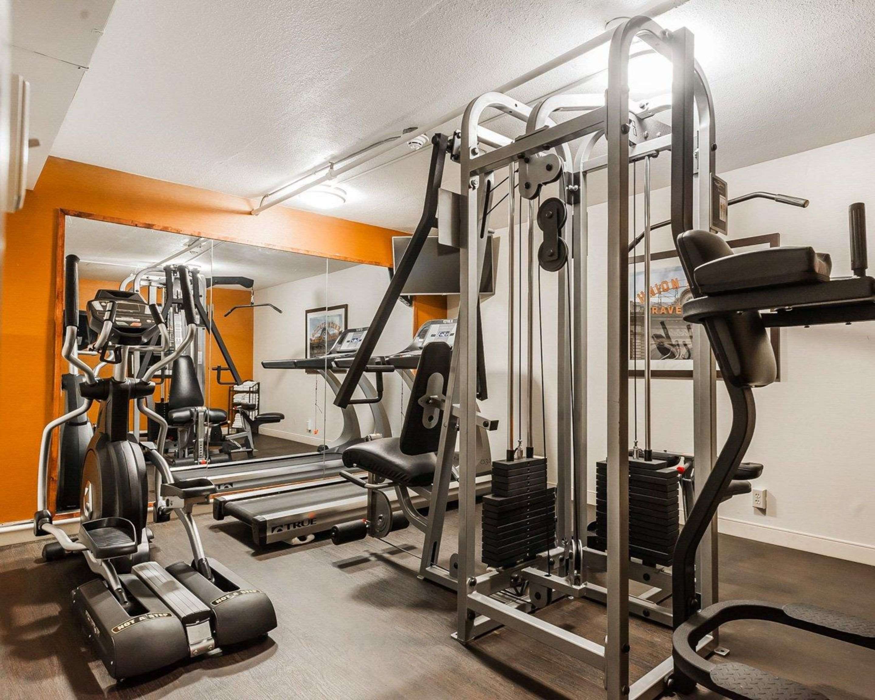 Exercise room with cardio equipment and weights