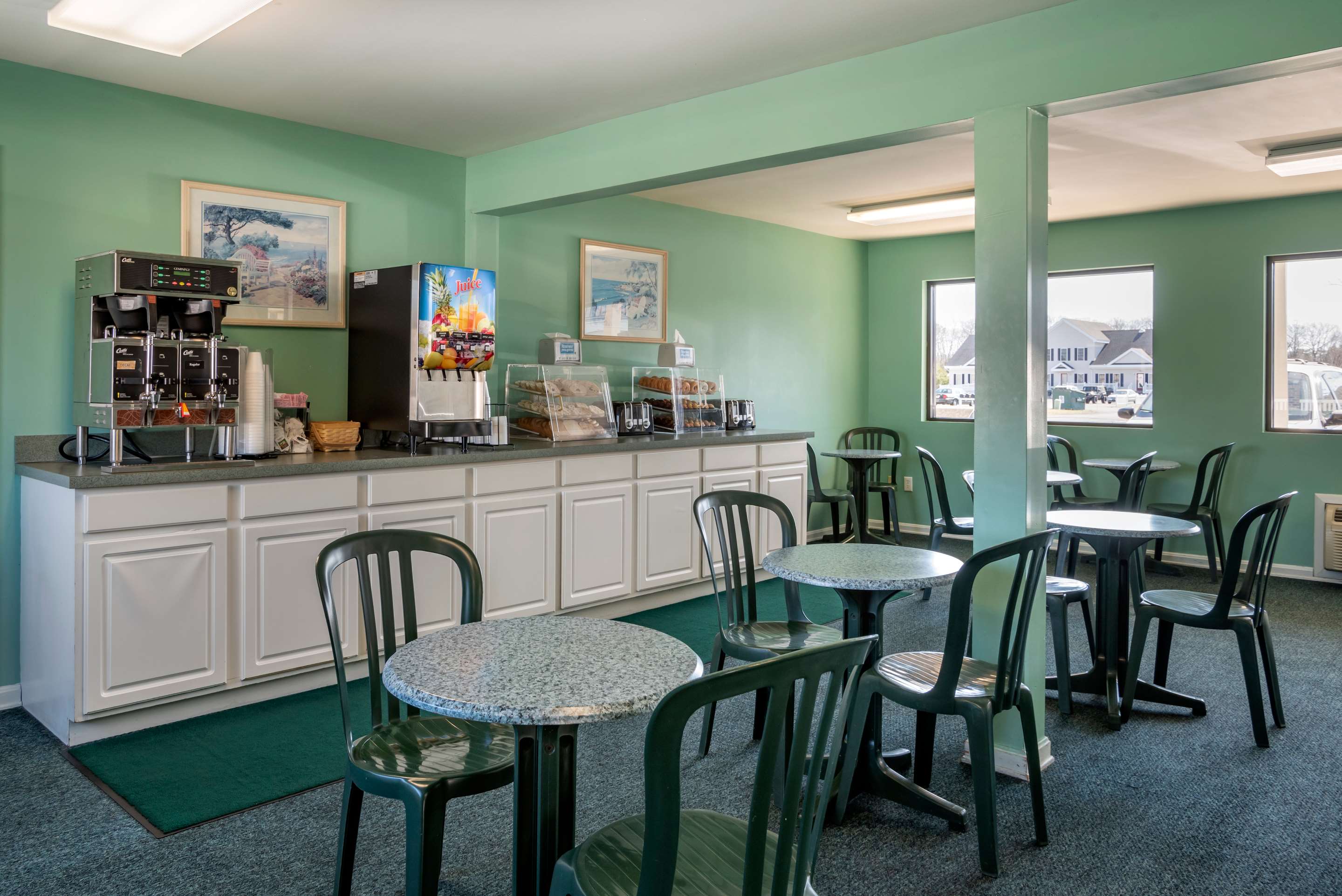 Enjoy breakfast in this seating area | Rodeway Inn & Suites - Rehoboth Beach