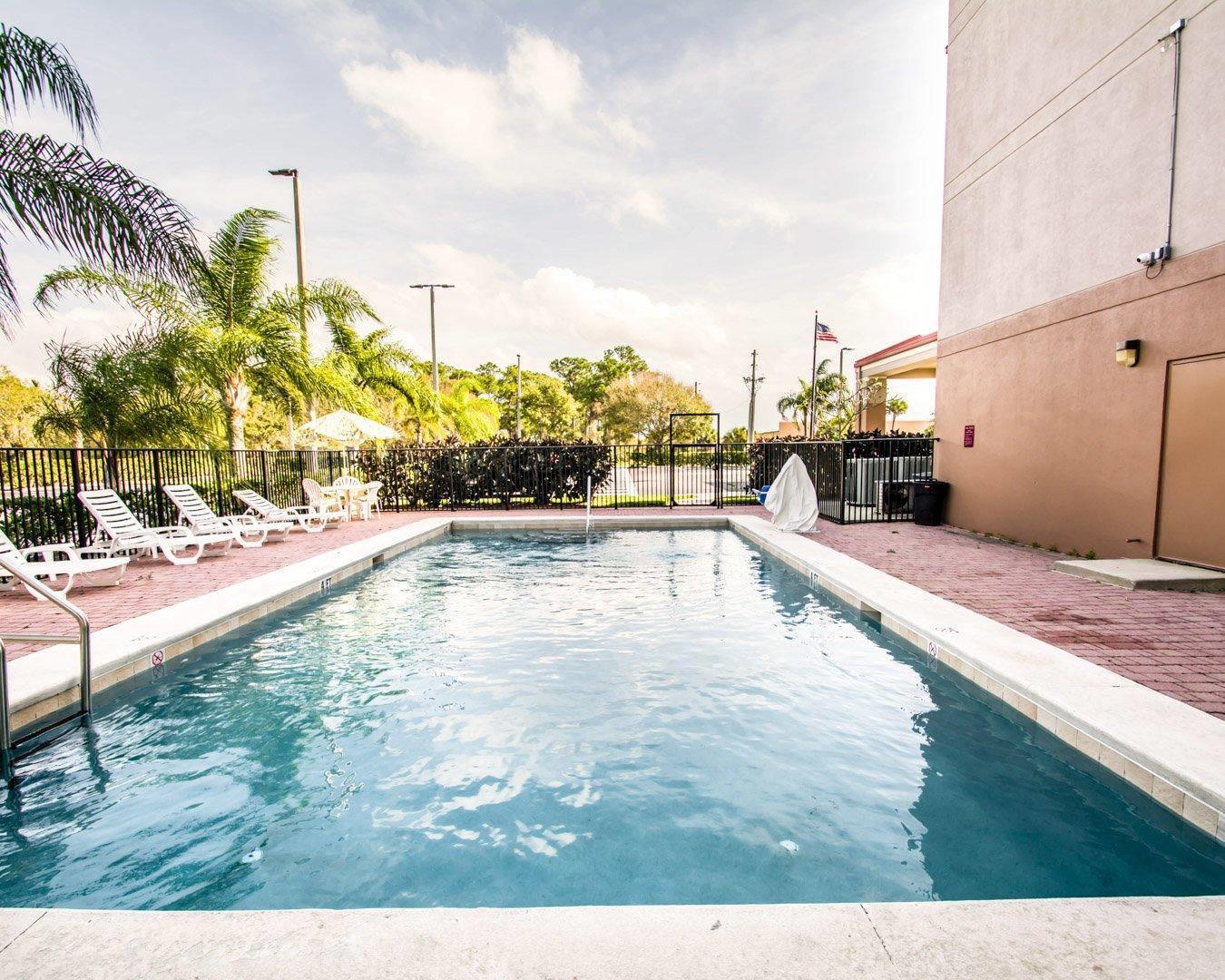 Outdoor pool with sundeck | Sleep Inn Fort Pierce I-95