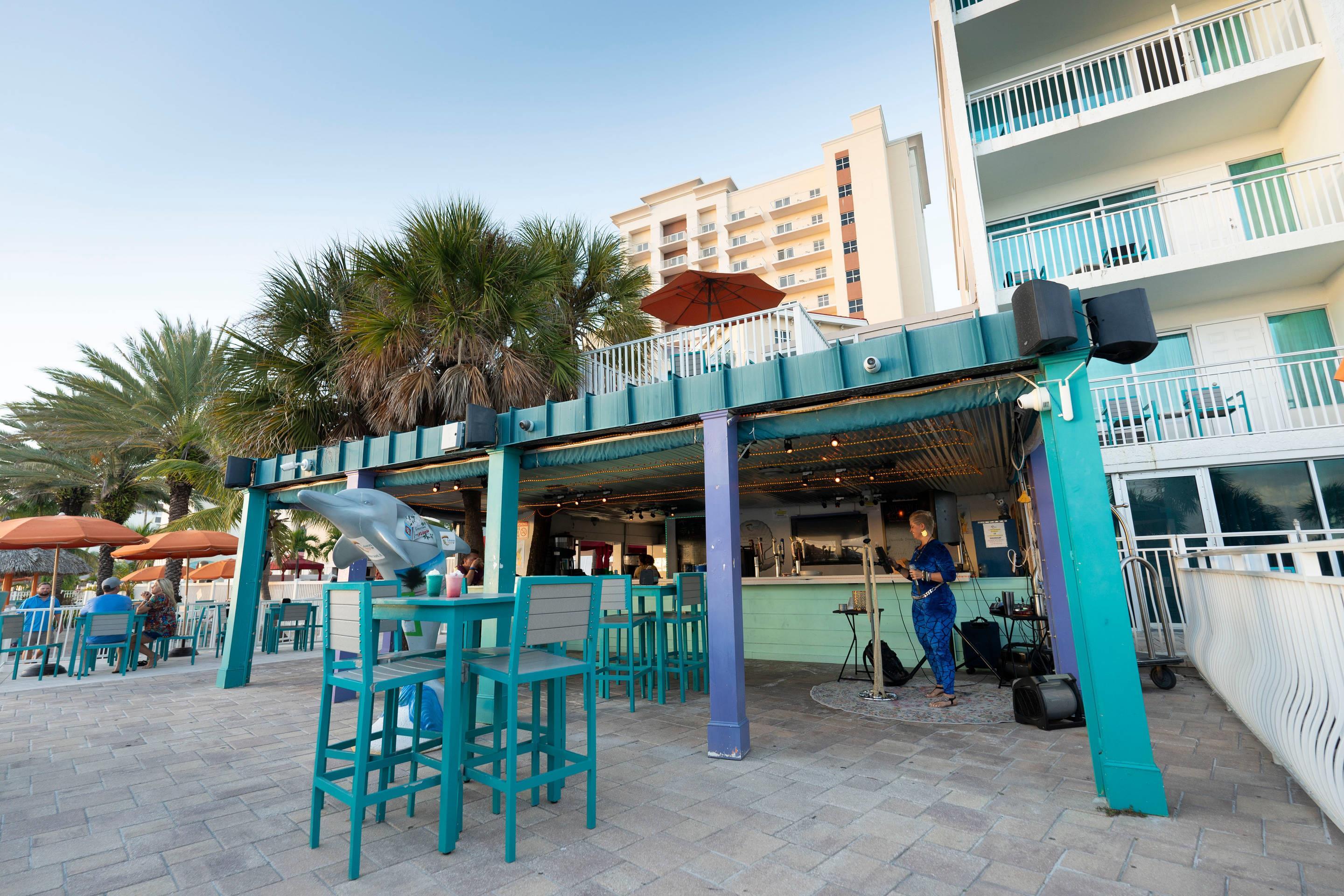 On-site restaurant | Winter the Dolphins Beach Club, Ascend Hotel Collection