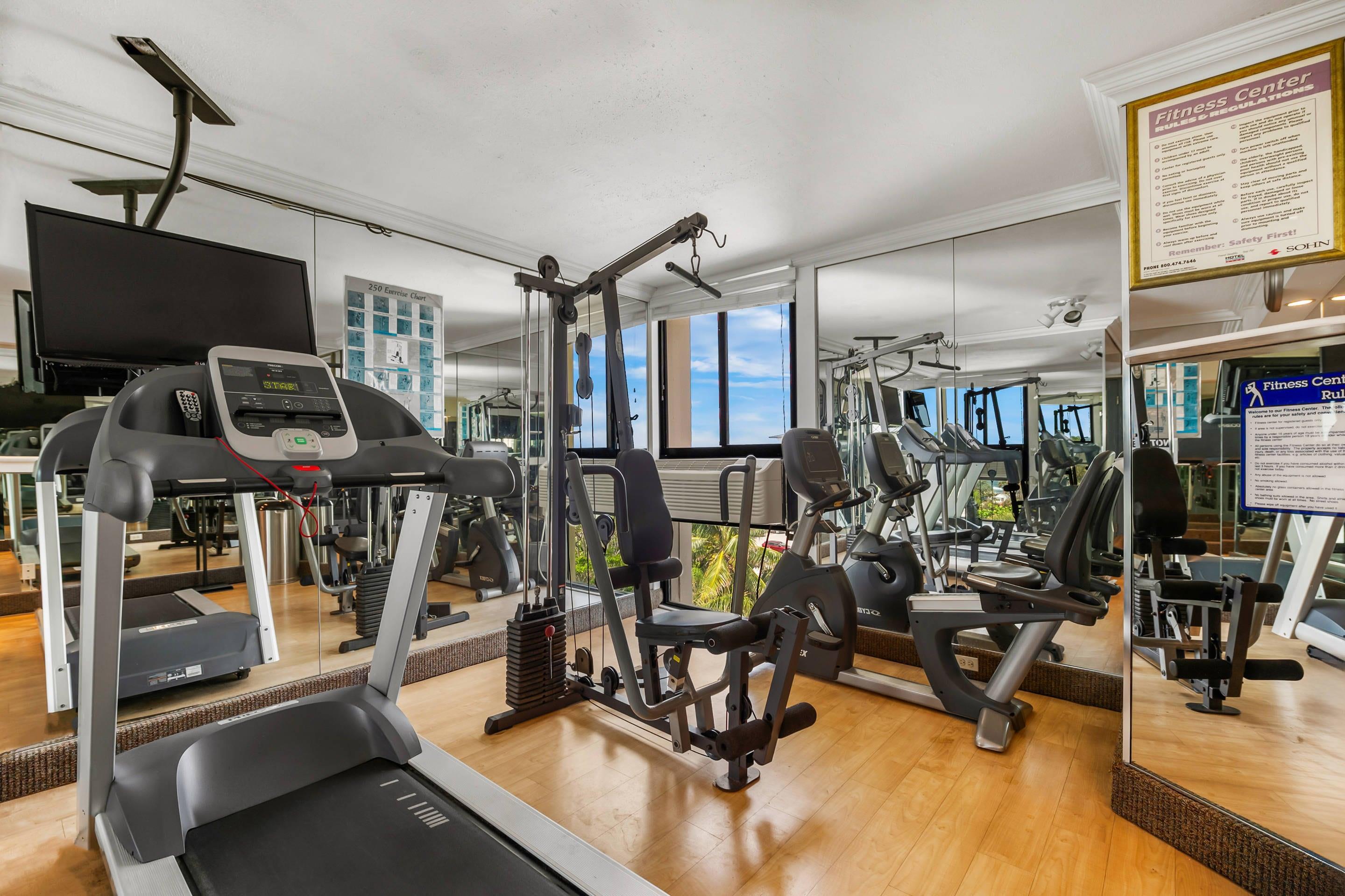 Exercise room with cardio equipment and weights