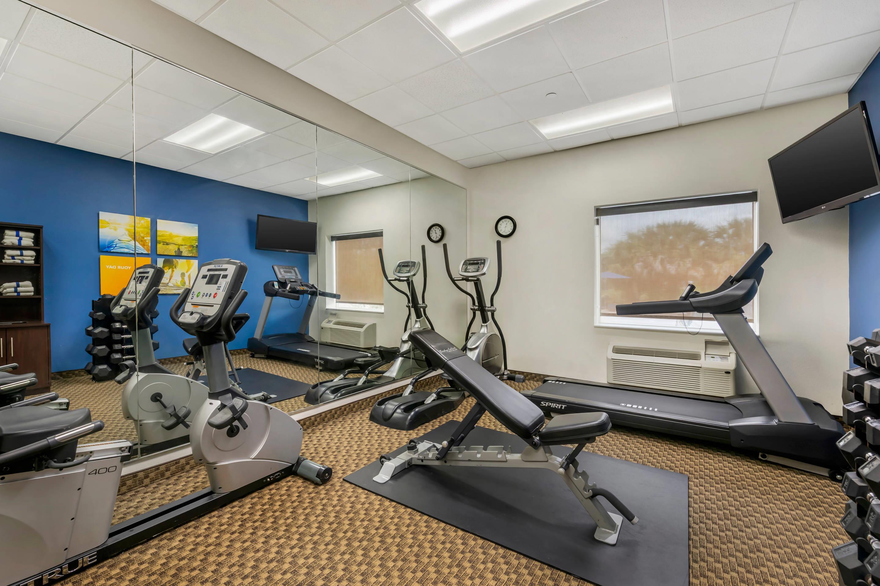 Exercise room with cardio equipment and weights | Comfort Inn & Suites Wildwood - The Villages