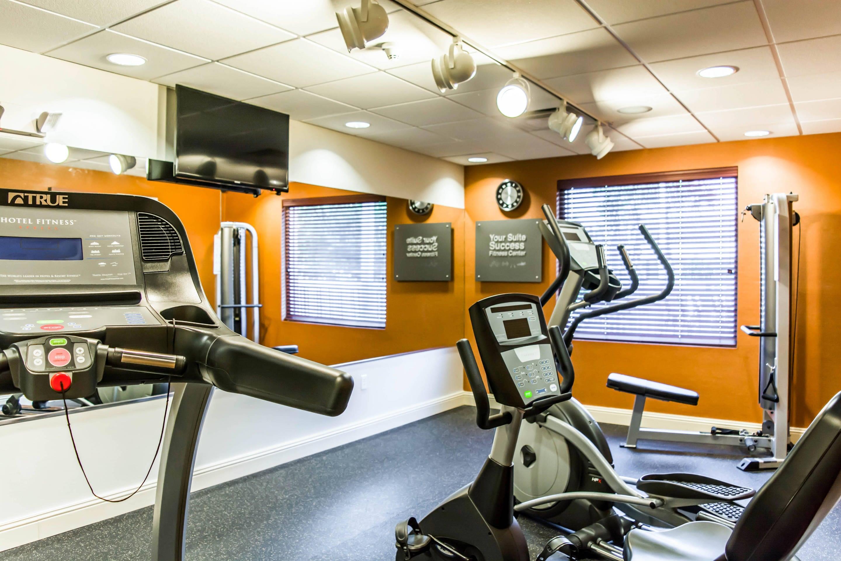 Fitness center with cardio equipment and weights | Comfort Suites Palm Bay - Melbourne