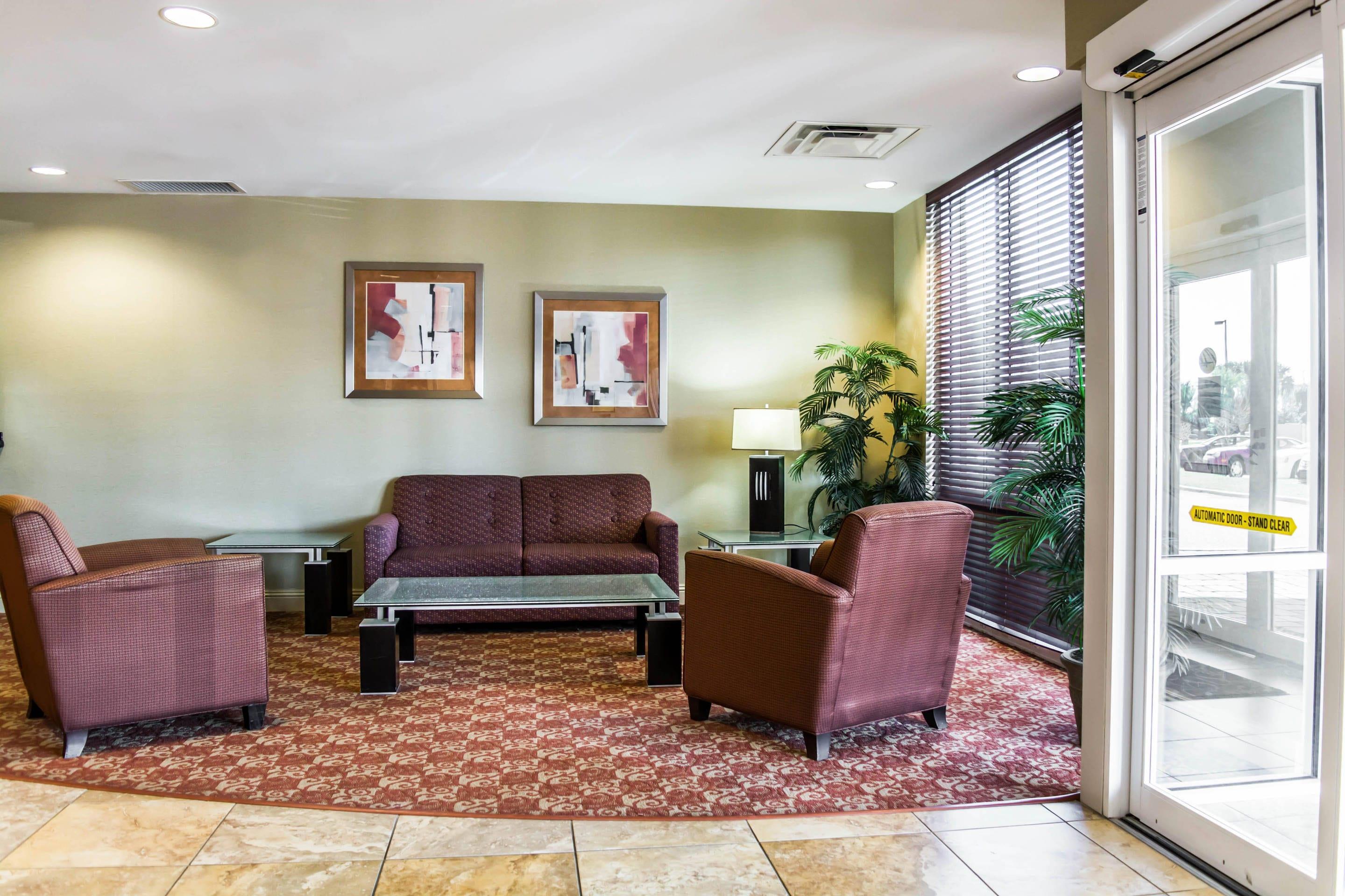 Spacious lobby with sitting area | Comfort Suites Palm Bay - Melbourne