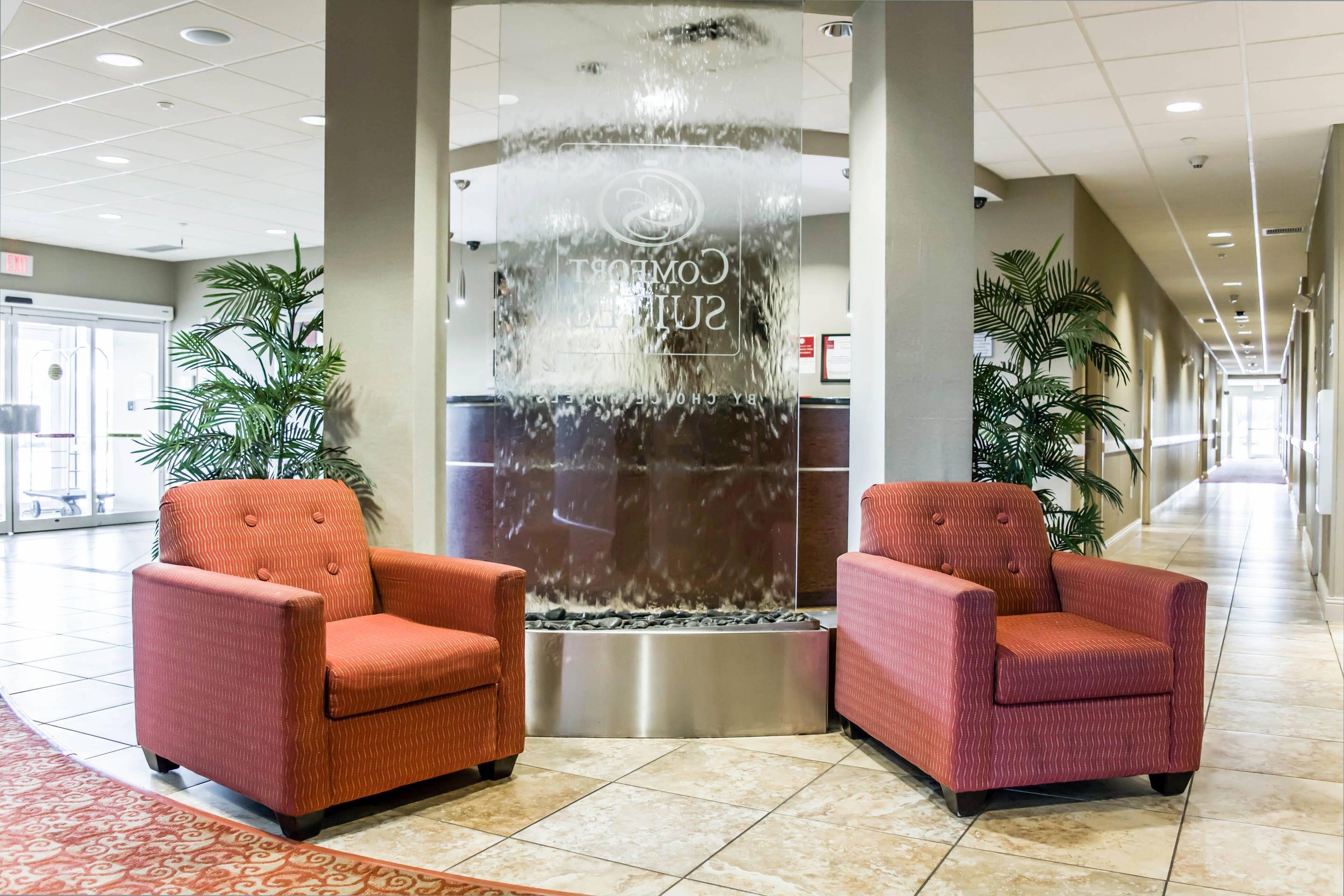 Spacious lobby with sitting area | Comfort Suites Palm Bay - Melbourne