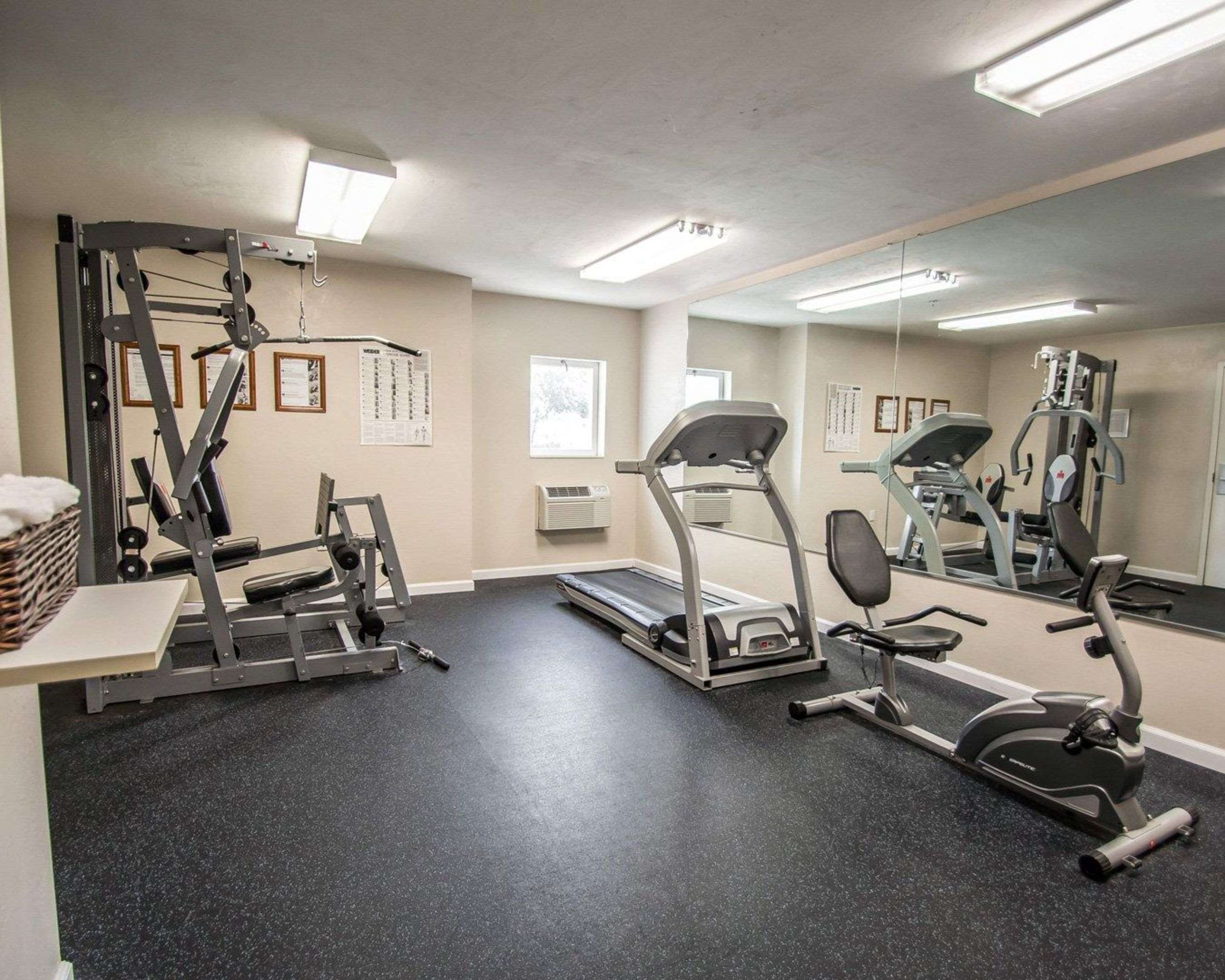 Exercise room with cardio equipment and weights