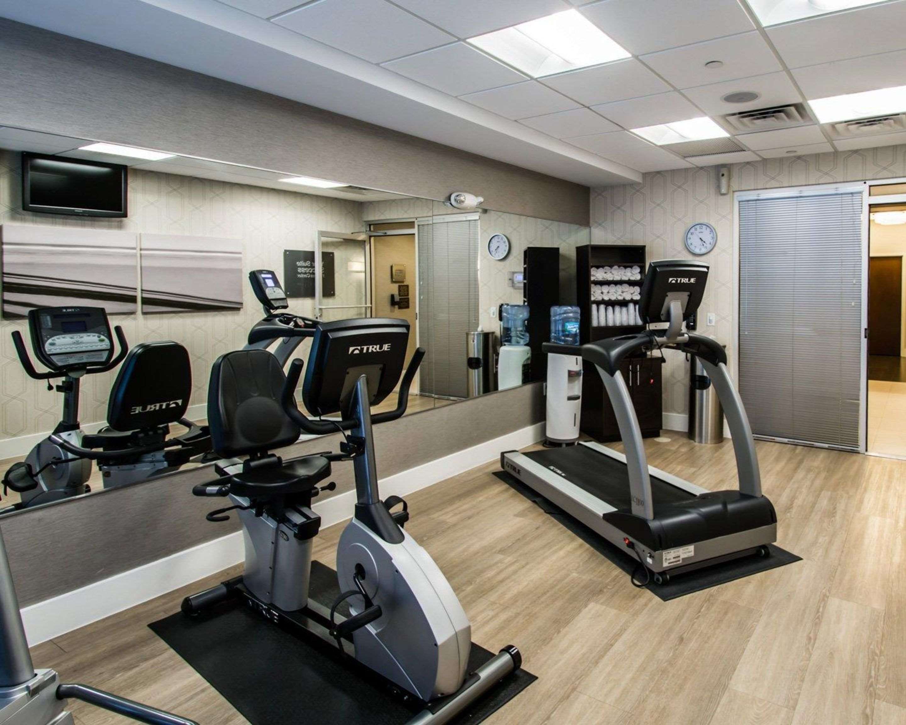 Fitness center with cardio equipment and weights | Comfort Suites Miami Airport North