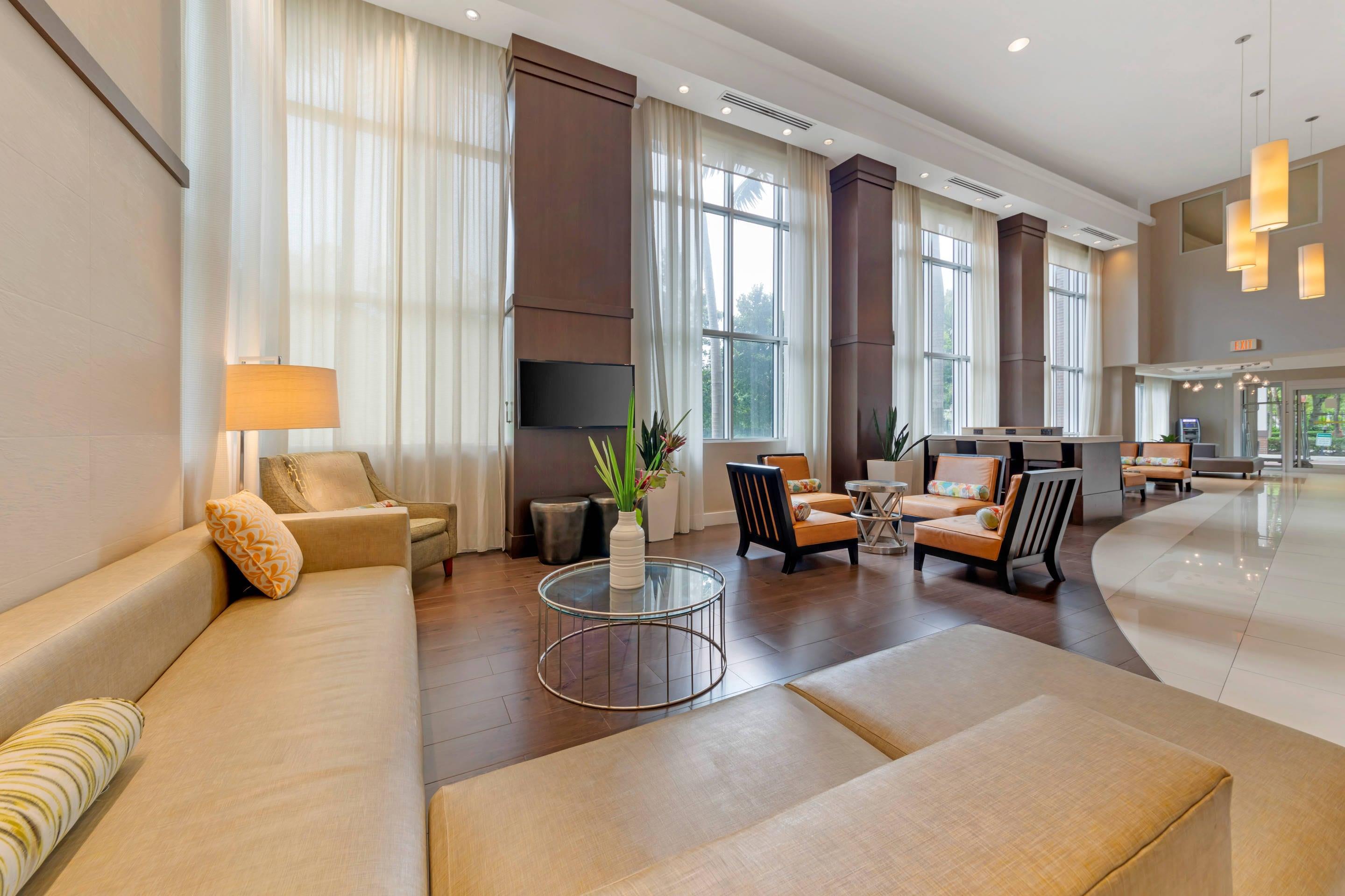Lobby with sitting area | Comfort Suites Miami Airport North