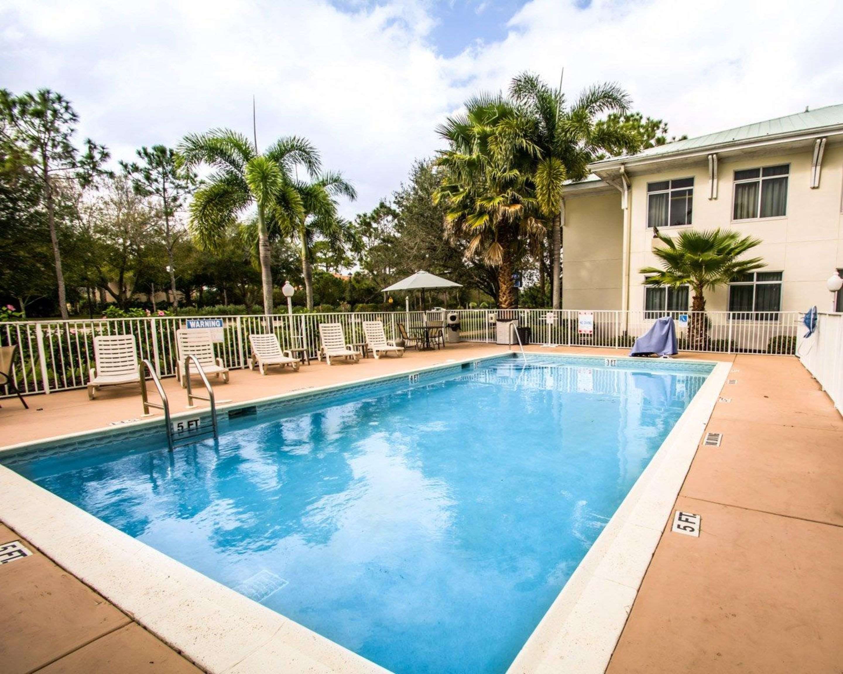 Outdoor pool with sundeck | Sleep Inn at PGA Village