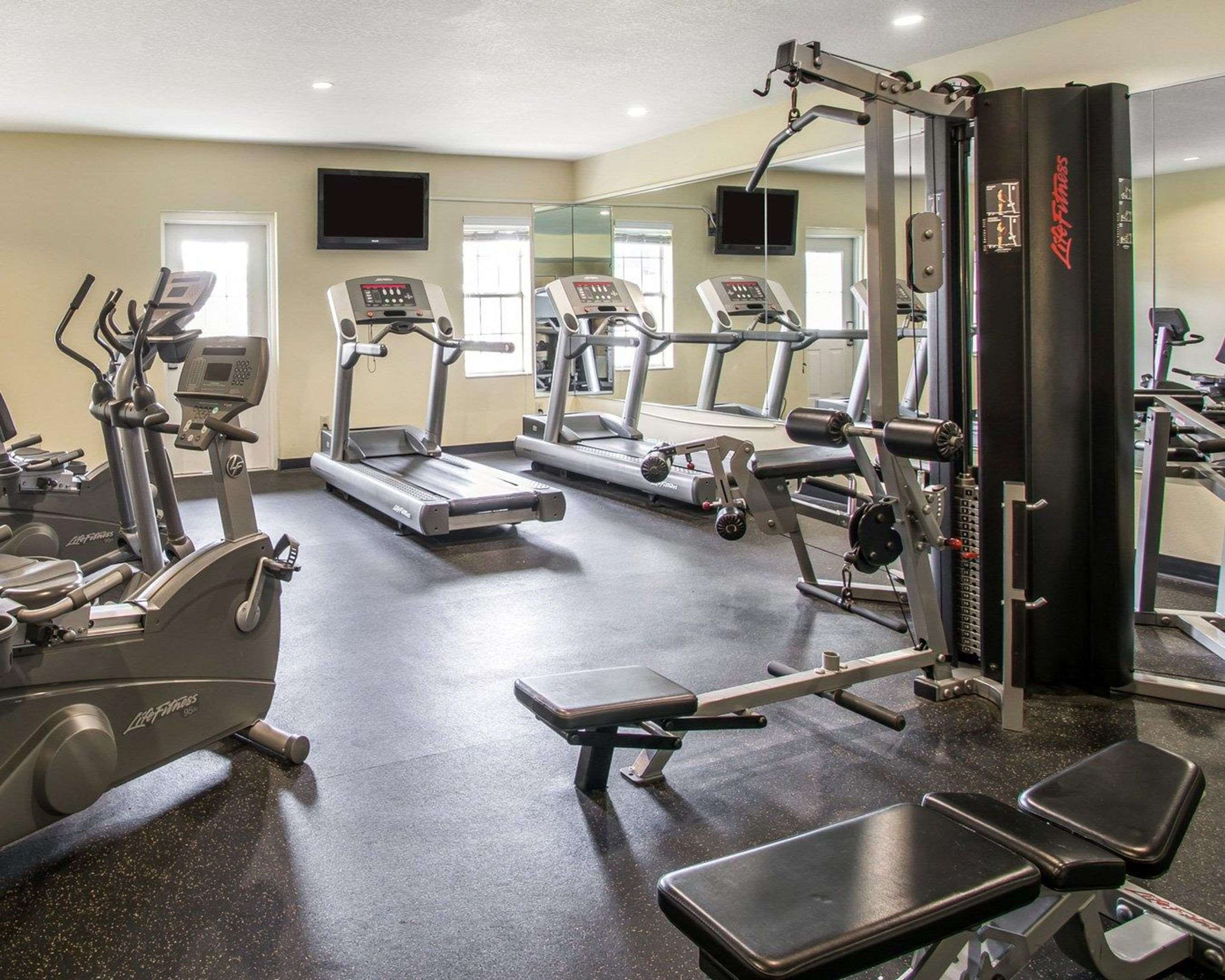 Fitness center with cardio equipment and weights | Plantation on Crystal River, Ascend Hotel Collection