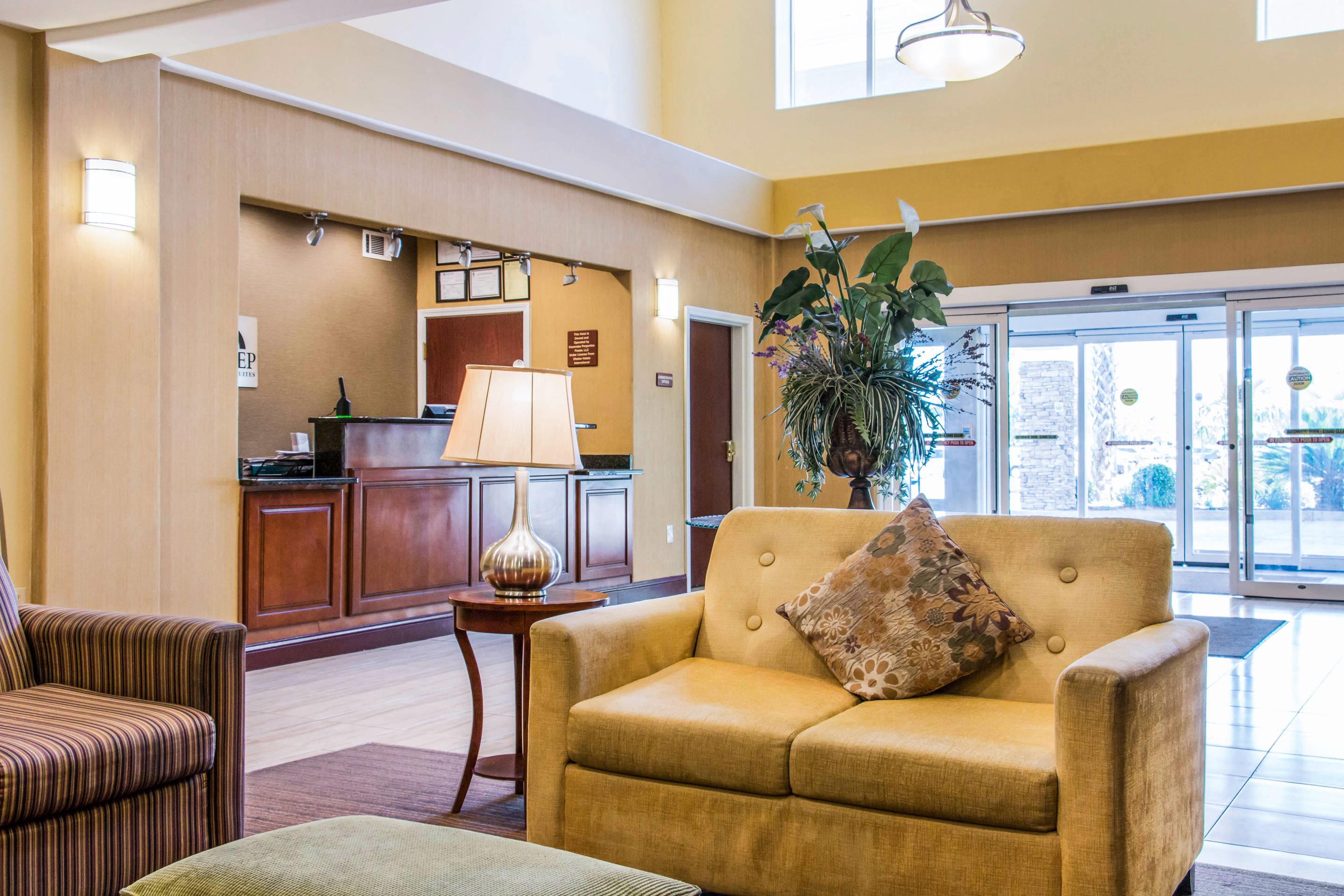 Spacious lobby with sitting area | Sleep Inn & Suites Pooler