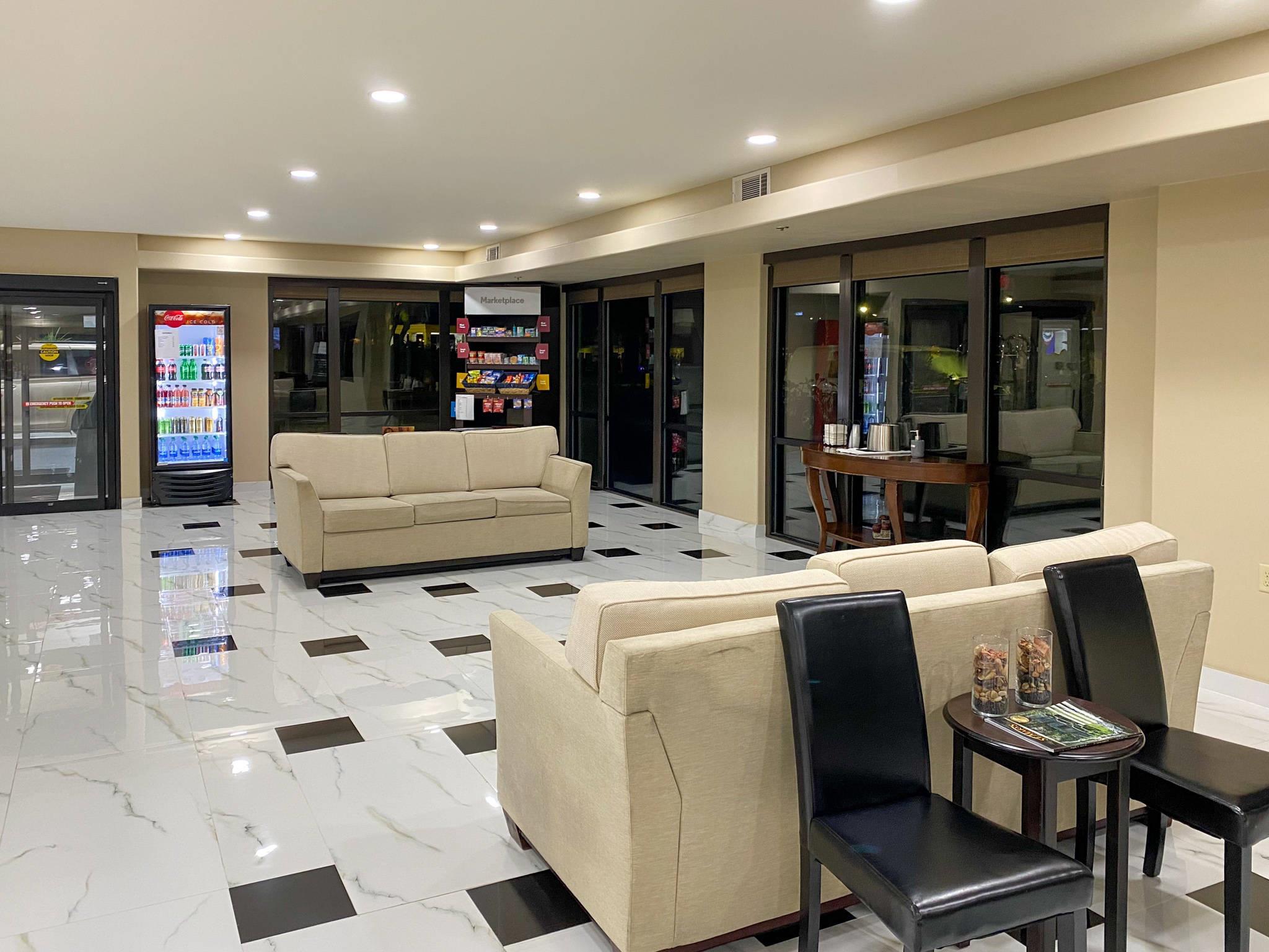 Spacious lobby with sitting area | Comfort Suites Kings Bay Naval Base Area