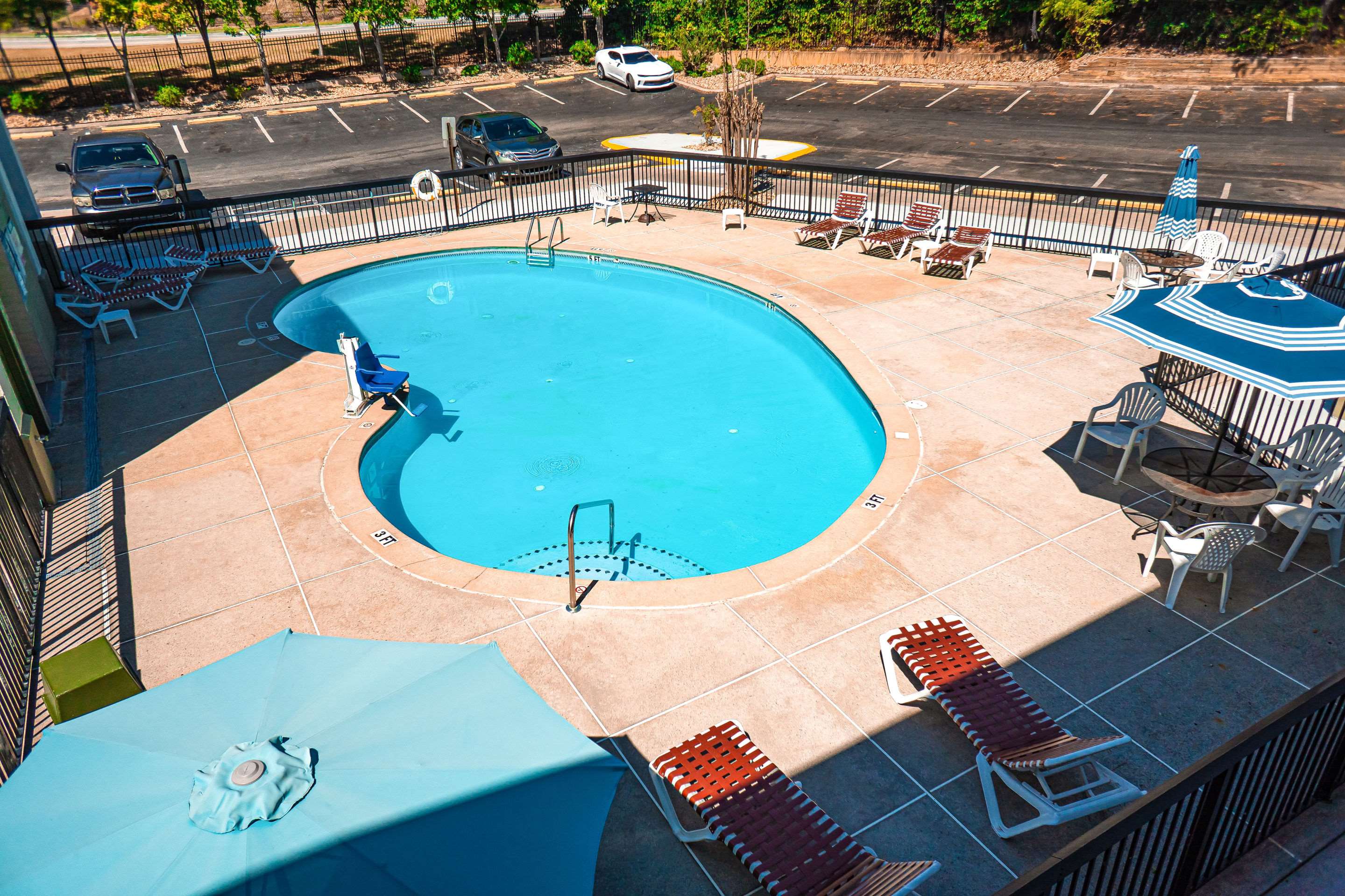 Outdoor pool | Quality Inn & Suites near Six Flags - Austell