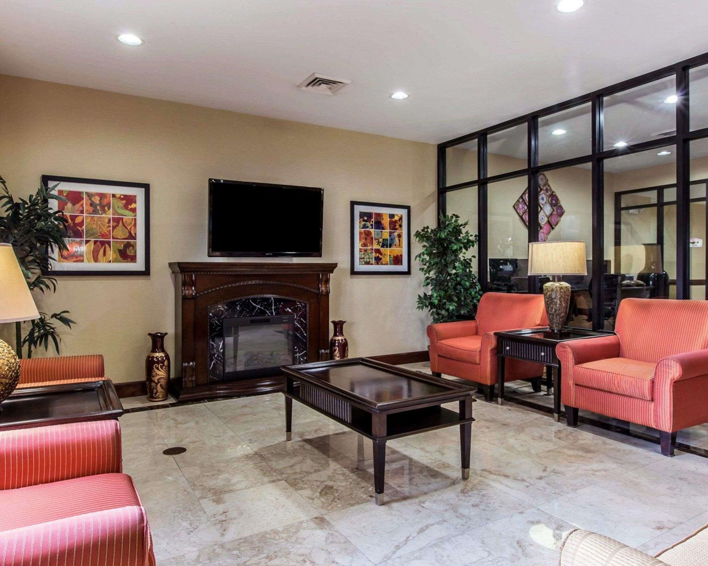Relax by the fireplace in the lobby | Comfort Suites Waycross