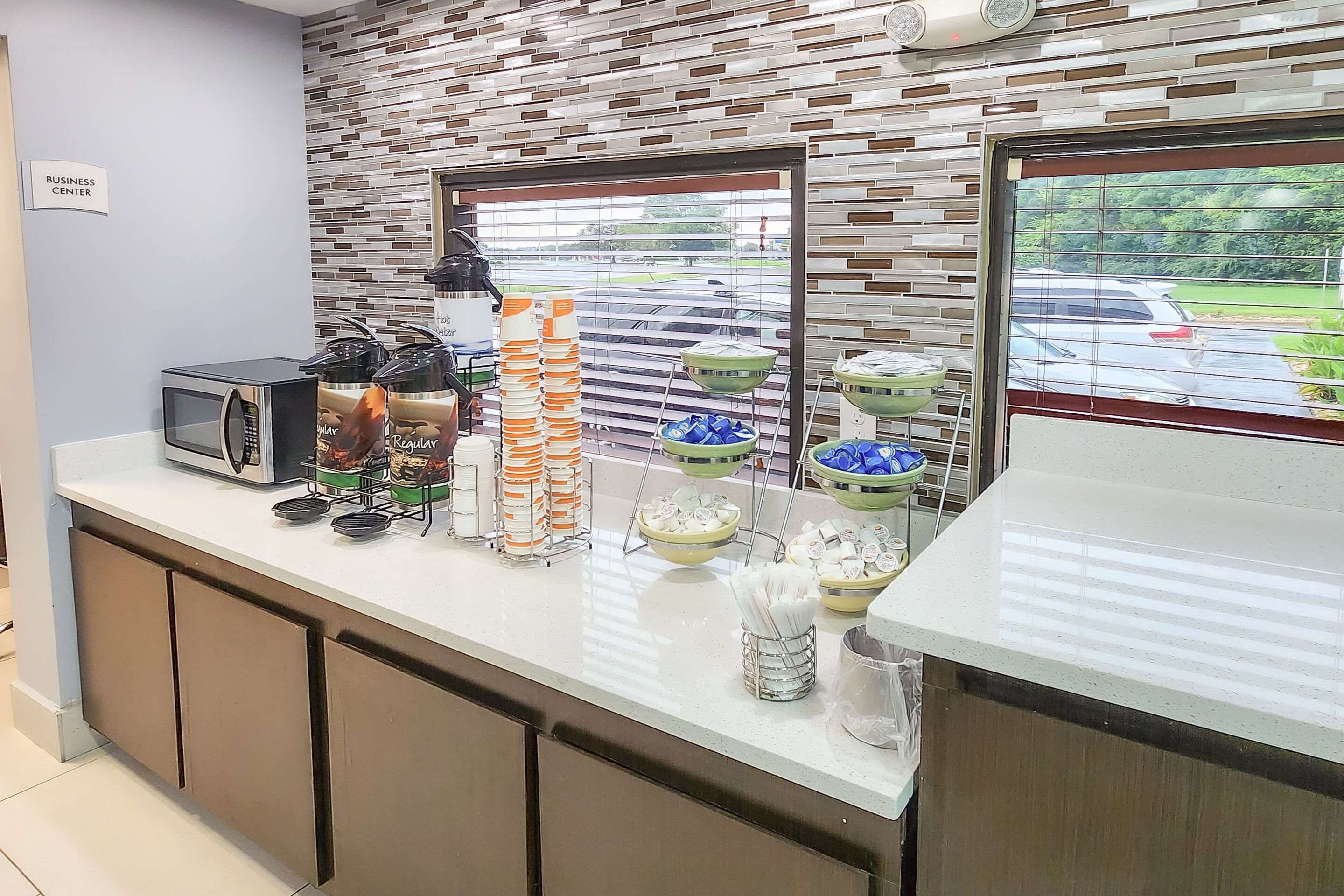 Enjoy breakfast in this seating area | Quality Inn at Albany Mall