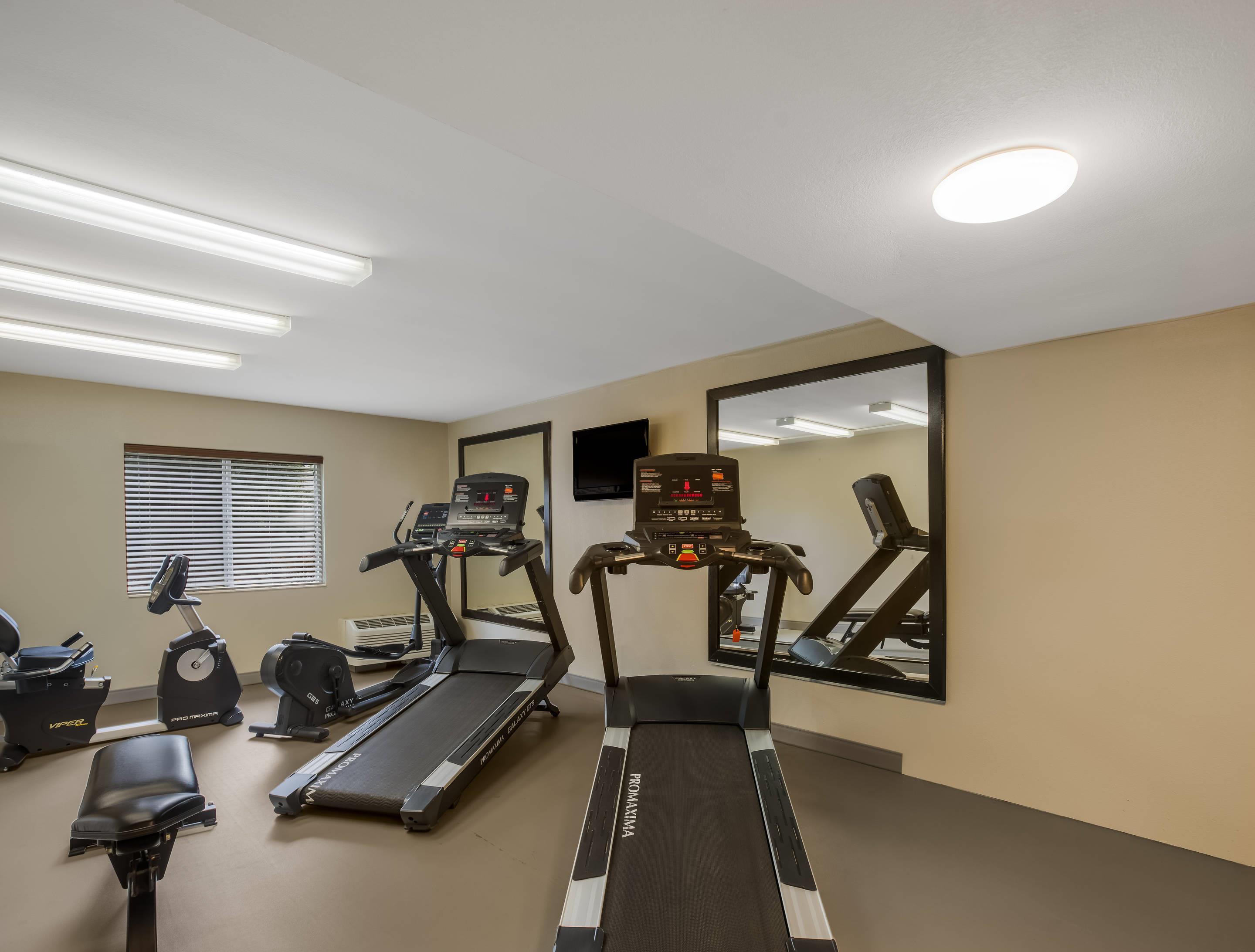 Exercise room with cardio equipment | Sleep Inn Savannah Midtown