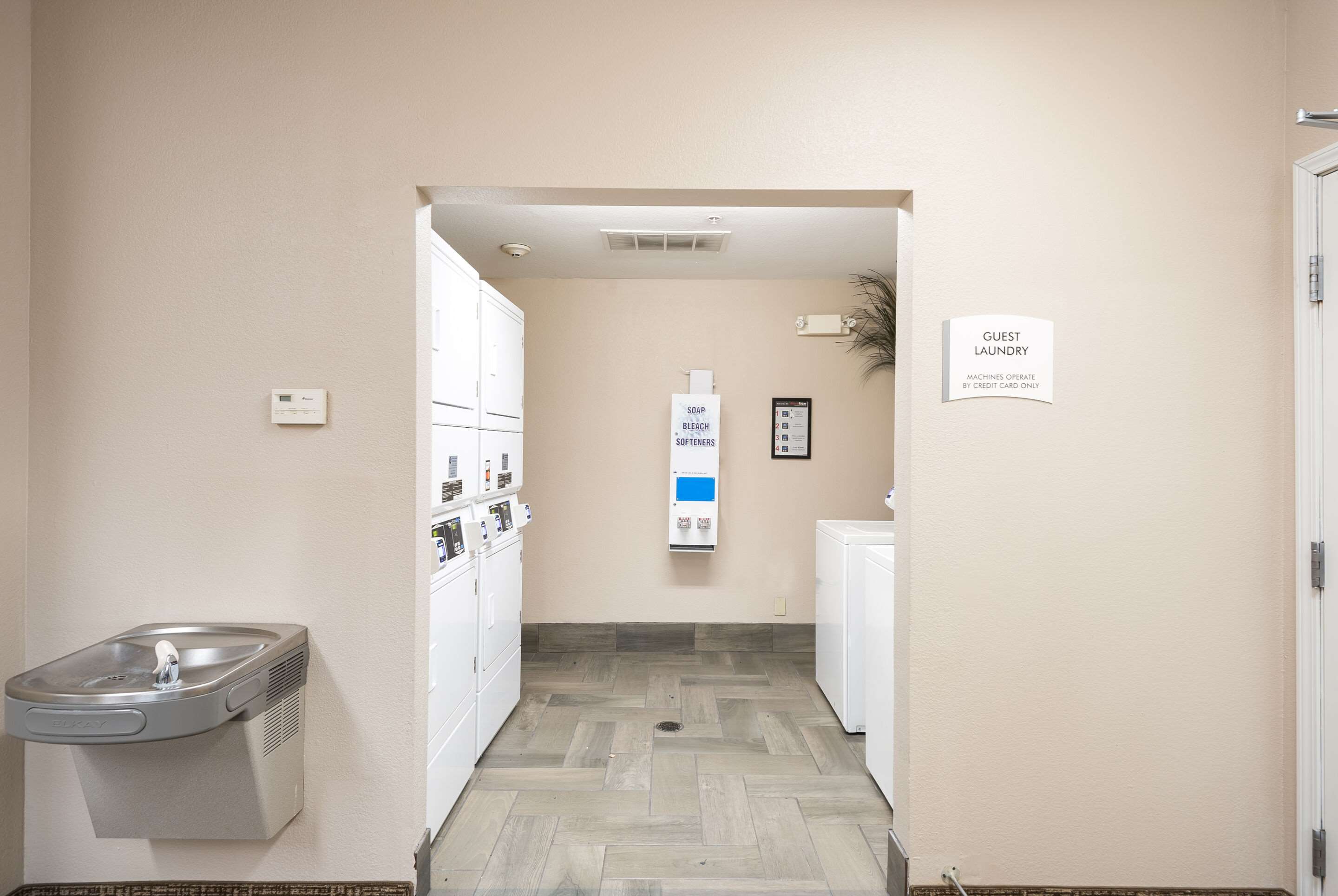Guest laundry facilities | Suburban Studios Waterloo - Cedar Falls - Cedar Valley