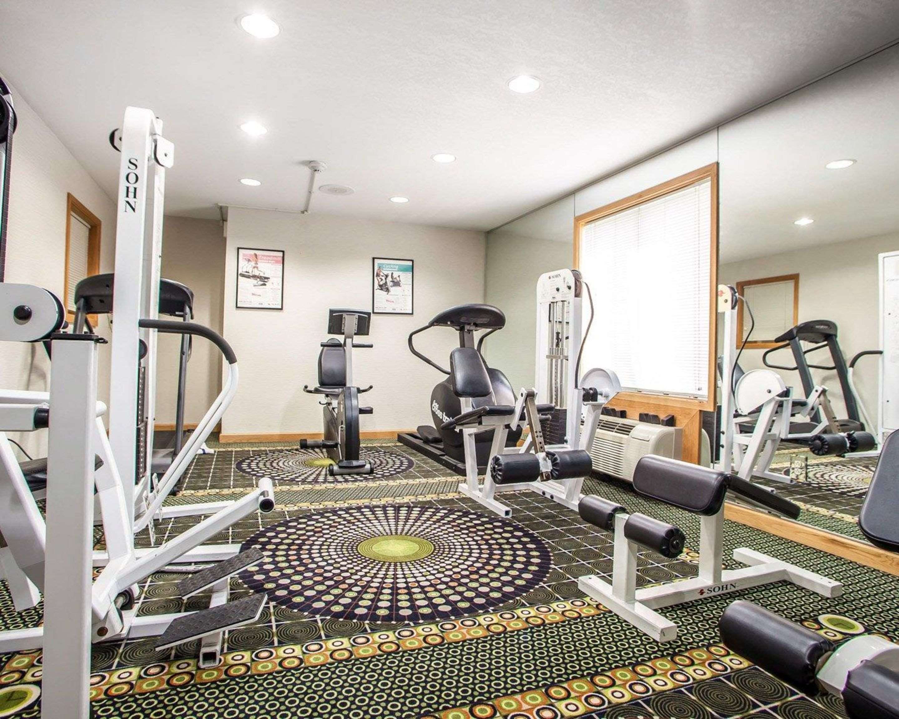 Exercise room with cardio equipment and weights | Comfort Inn Bourbonnais near I-57