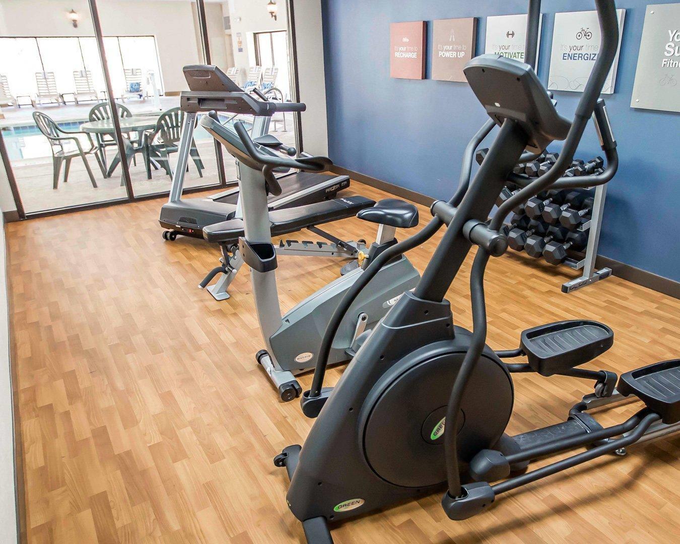 Exercise room with cardio equipment and weights