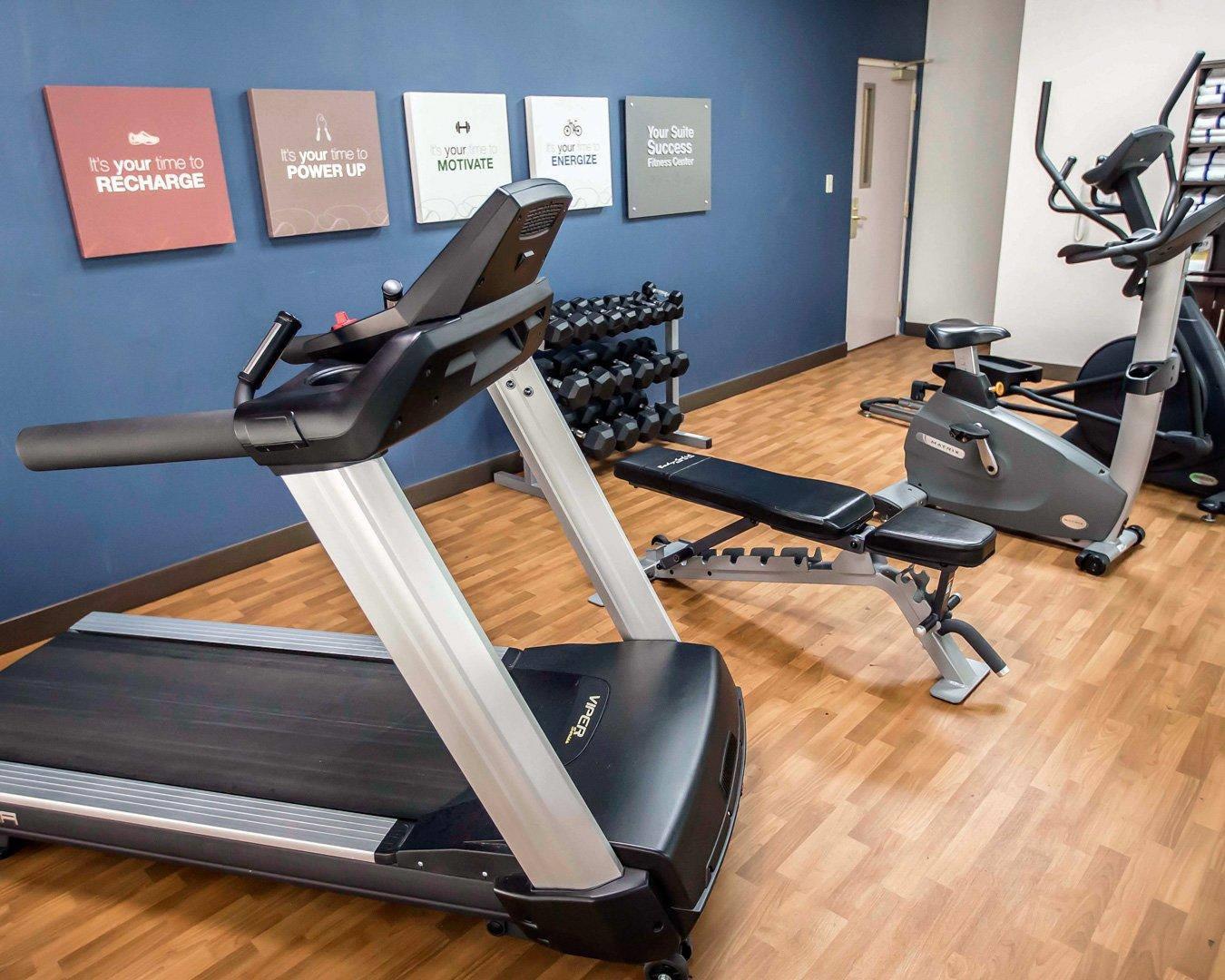 Exercise room with cardio equipment and weights