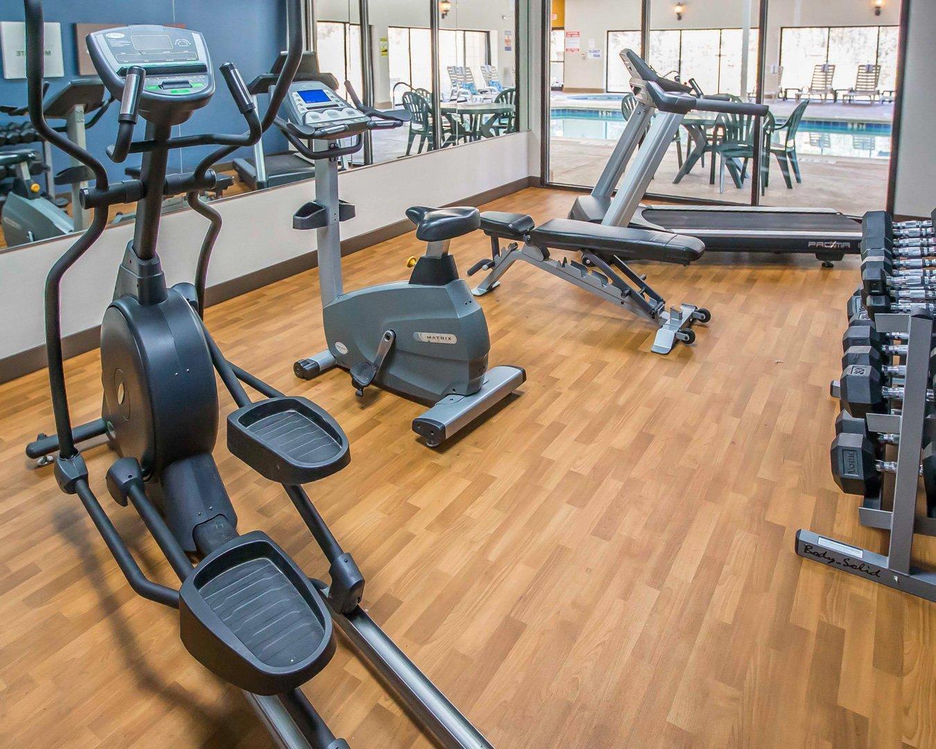 Exercise room with cardio equipment and weights