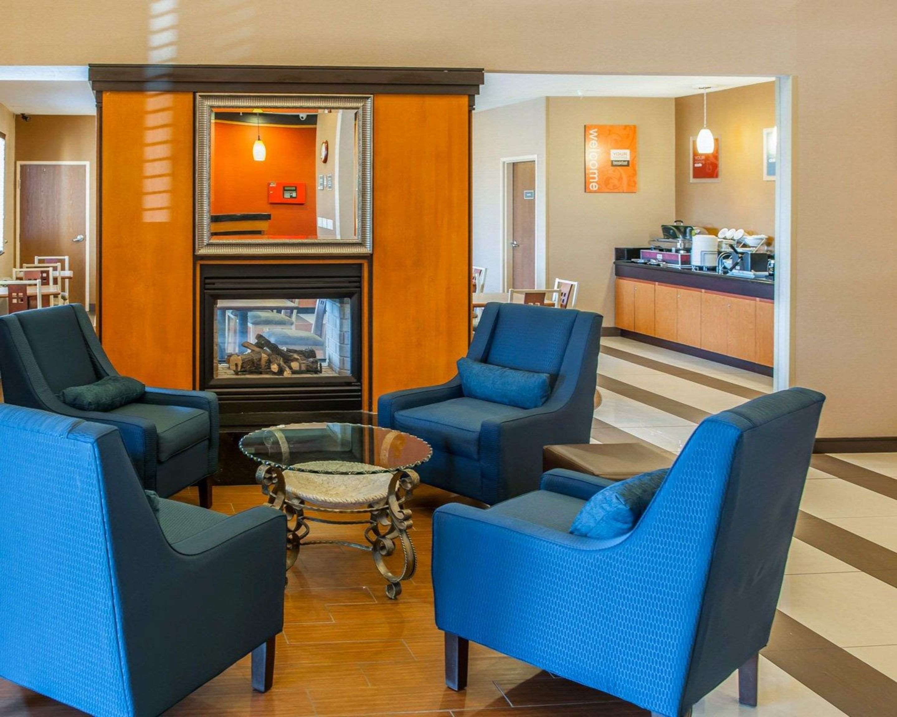 Spacious lobby with sitting area | Quality Suites NE Indianapolis Fishers