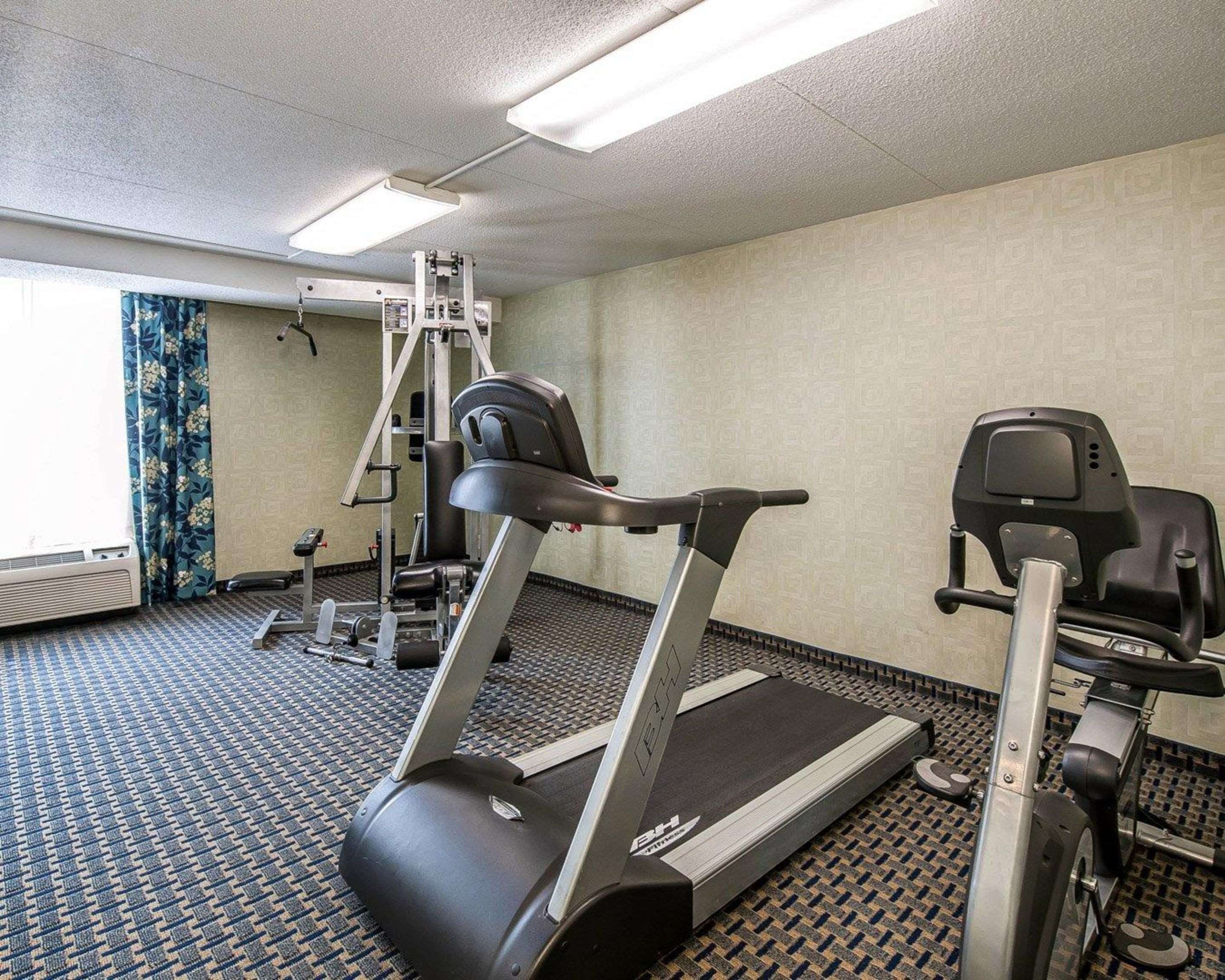 Exercise room with cardio equipment and weights | Quality Inn Terre Haute University Area
