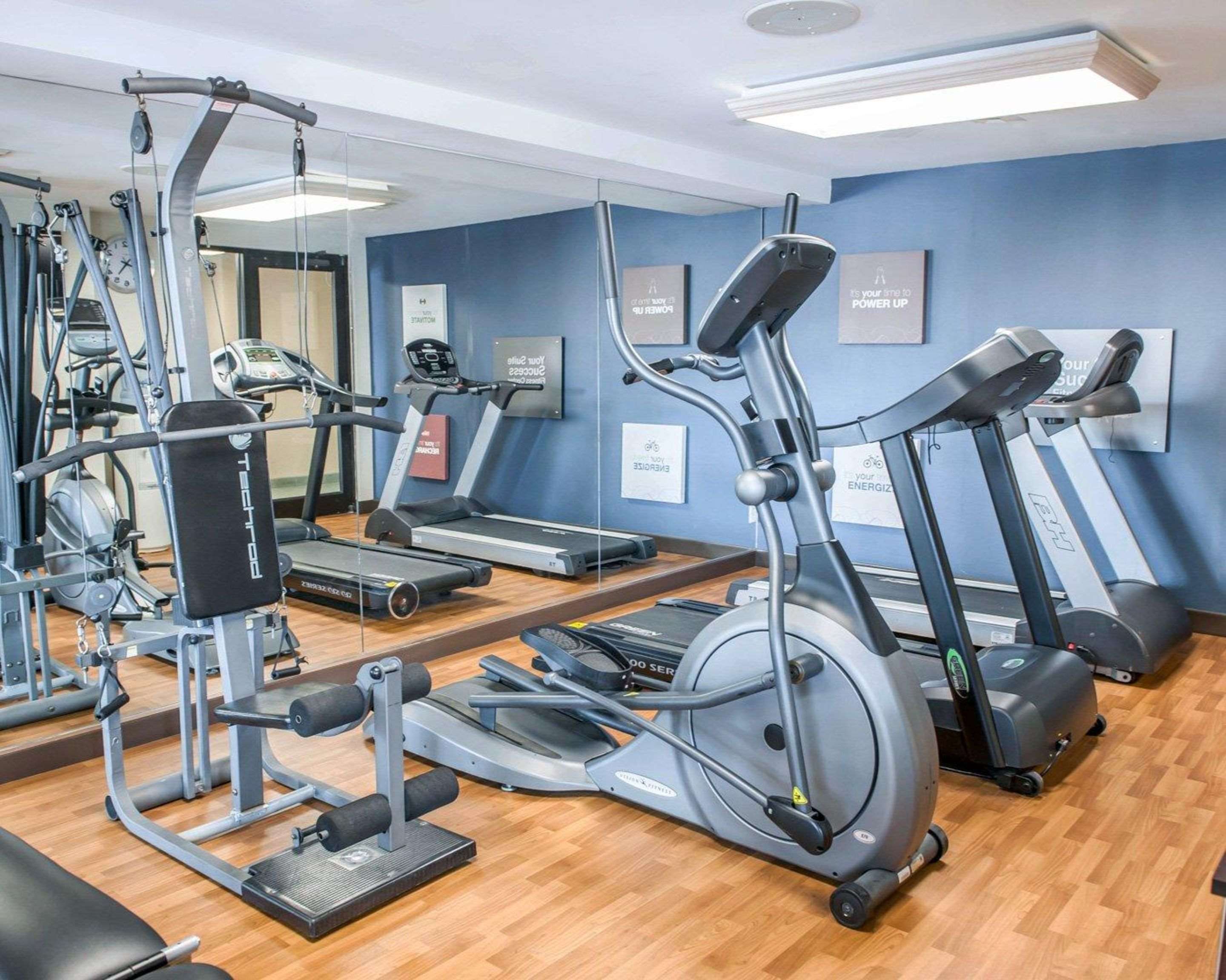 Exercise room with cardio equipment and weights | Comfort Suites South