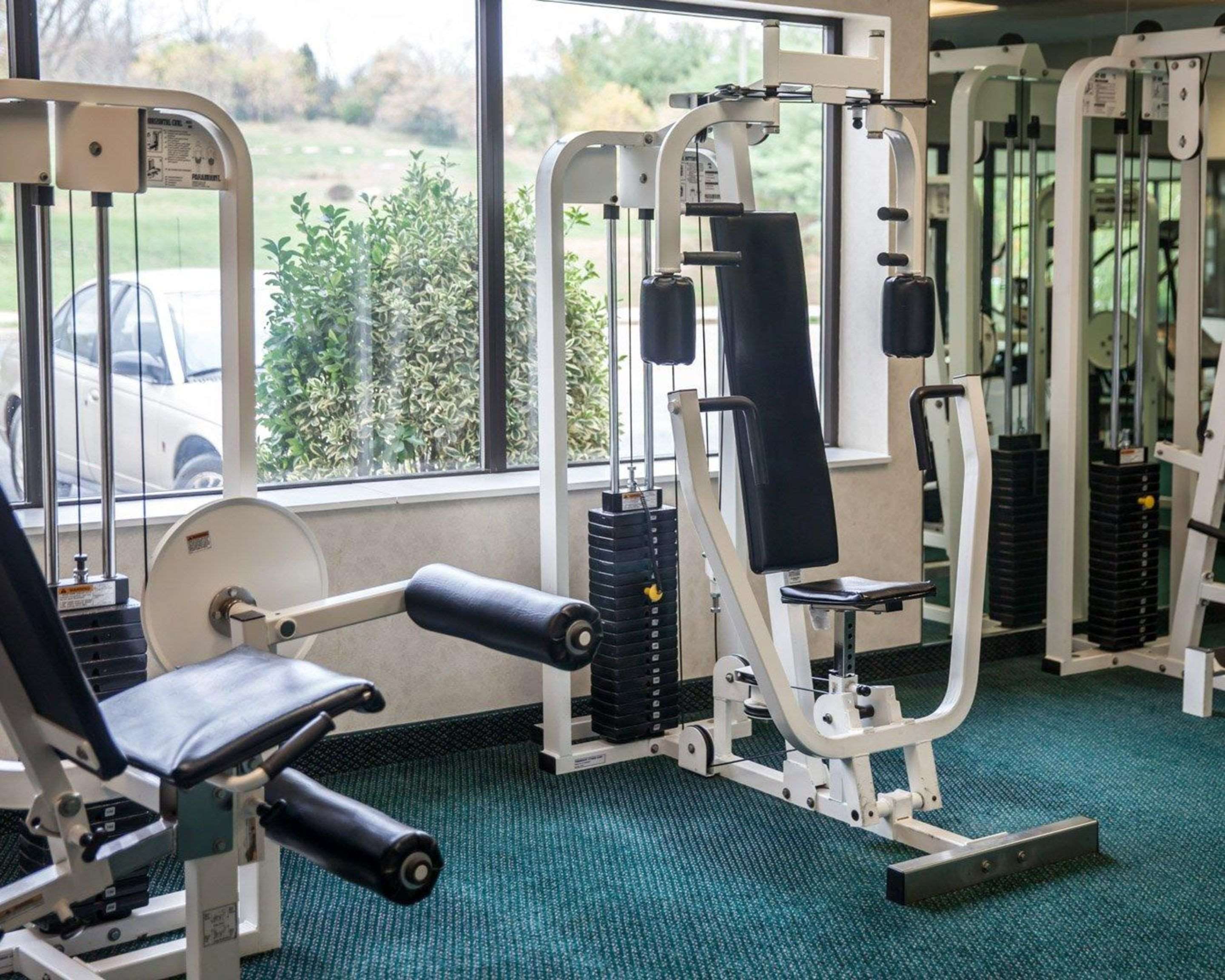 Fitness center with cardio equipment and weights | Sleep Inn & Suites