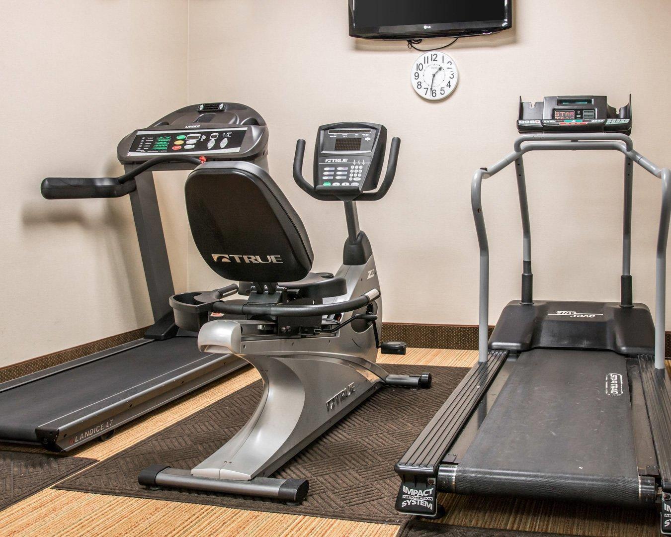 Exercise room with cardio equipment and weights | Comfort Inn & Suites and Conference Center