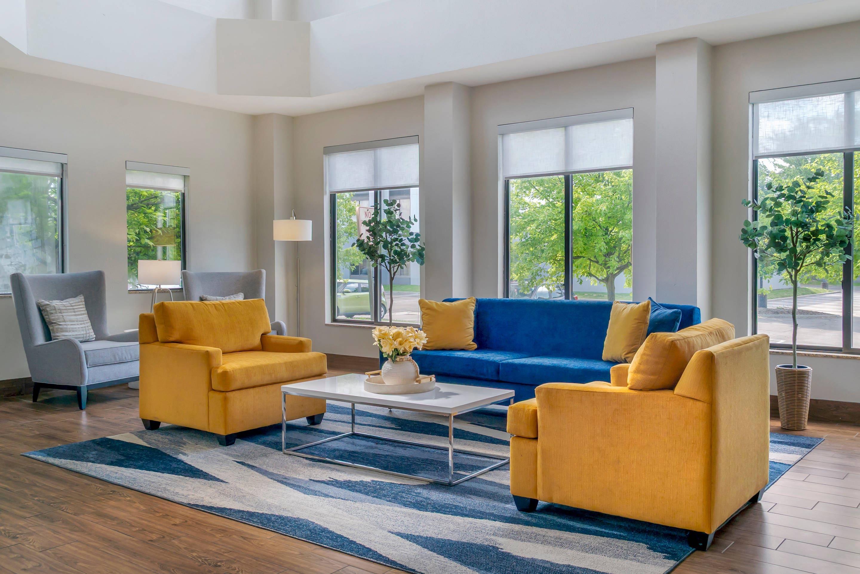 Spacious lobby with sitting area | Comfort Suites Auburn Hills-Detroit