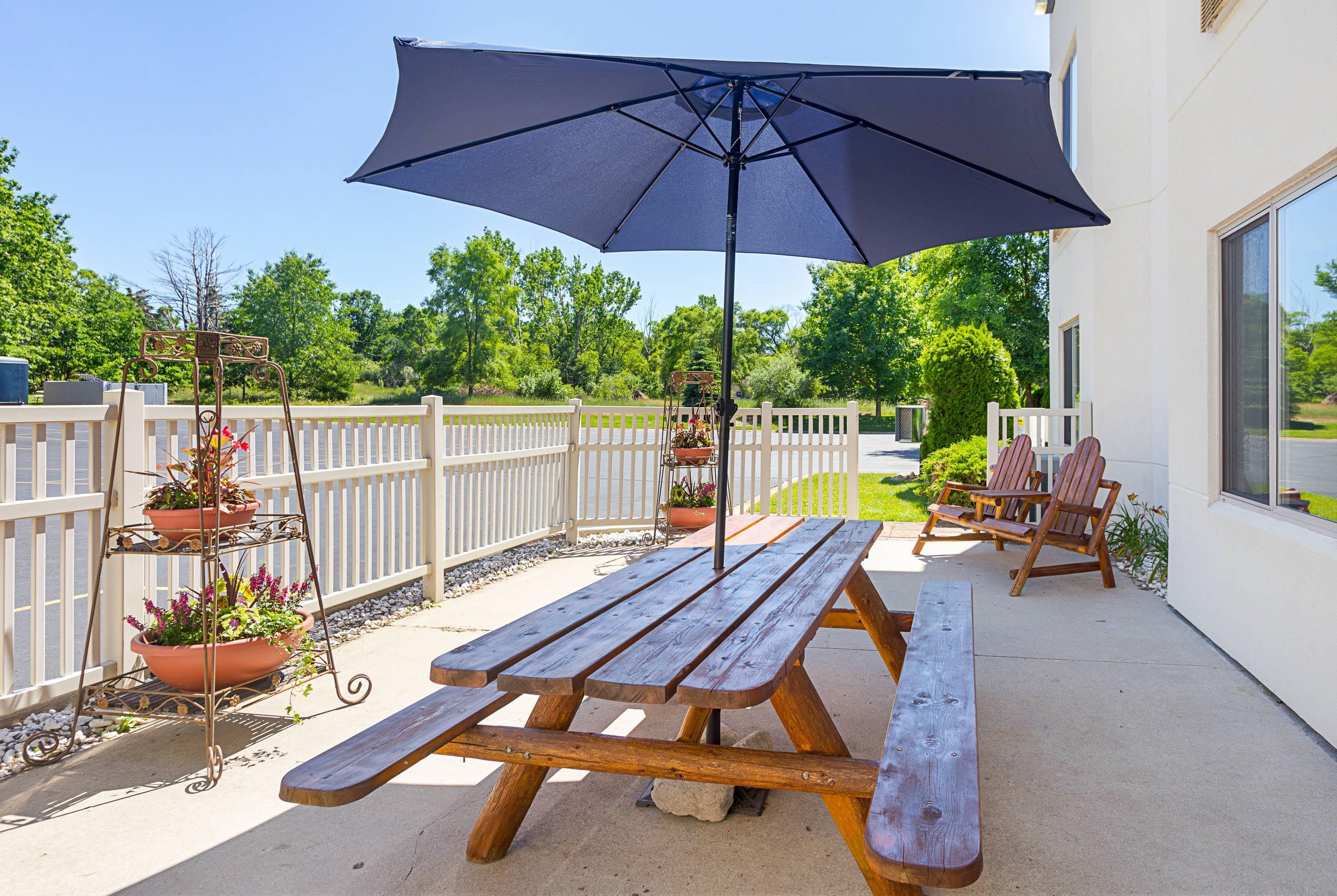Relax on hotel patio | Sleep Inn & Suites Acme – Traverse City