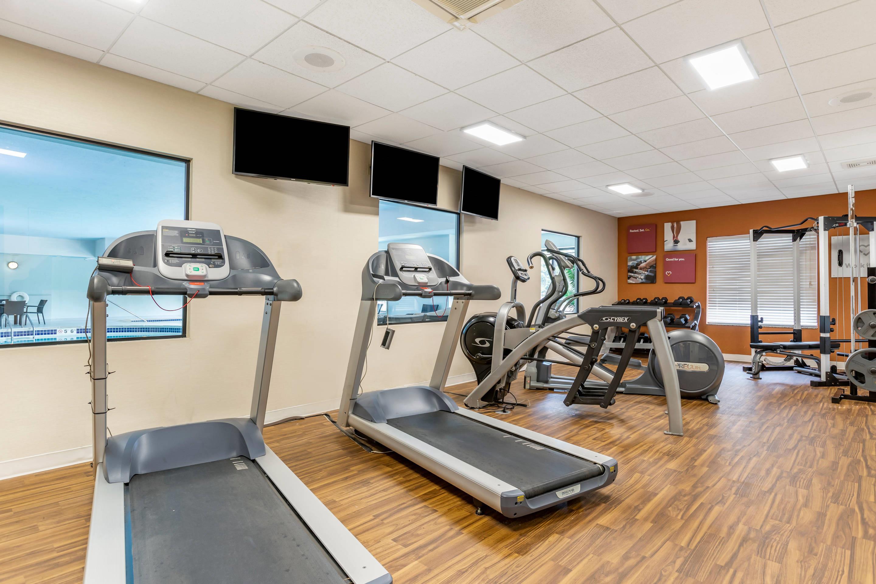 Exercise room with cardio equipment and weights | Comfort Suites Grand Rapids North