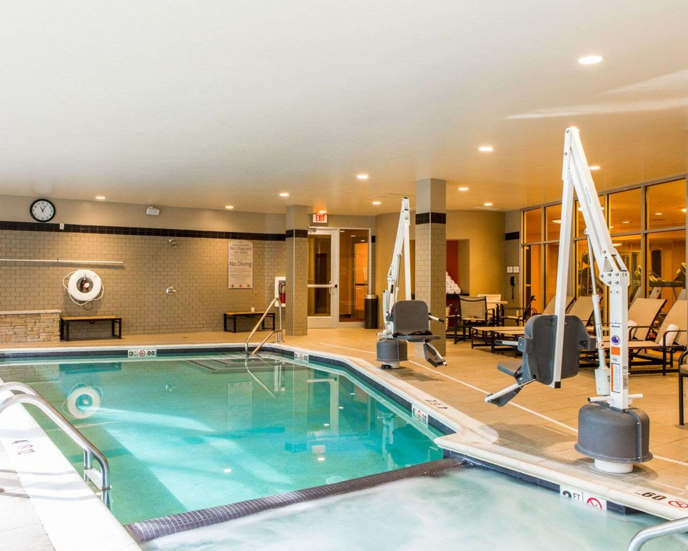 Beautiful indoor pool with hot tub | Cambria Hotel Traverse City