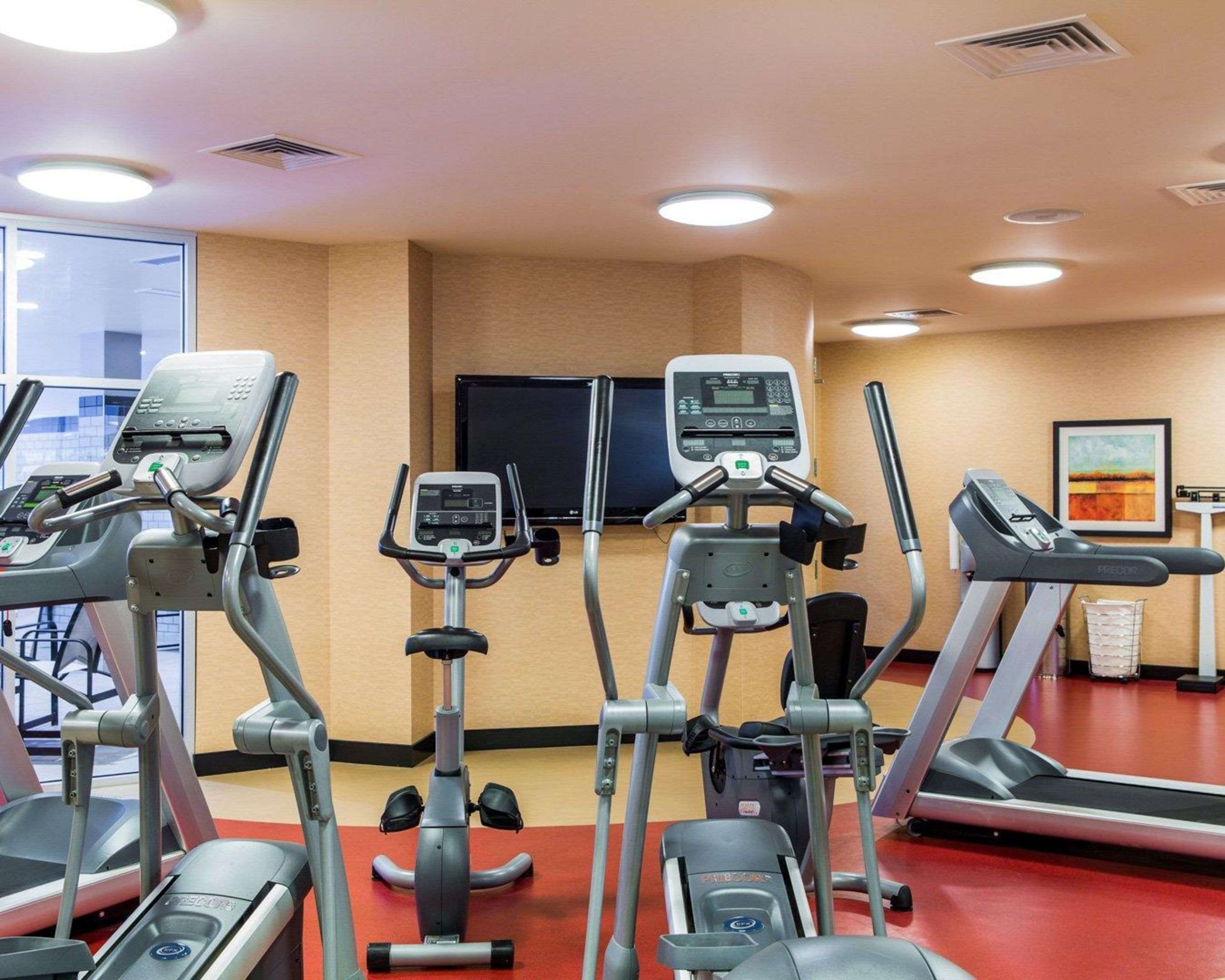 Fitness center with cardio equipment and weights | Cambria Hotel Traverse City