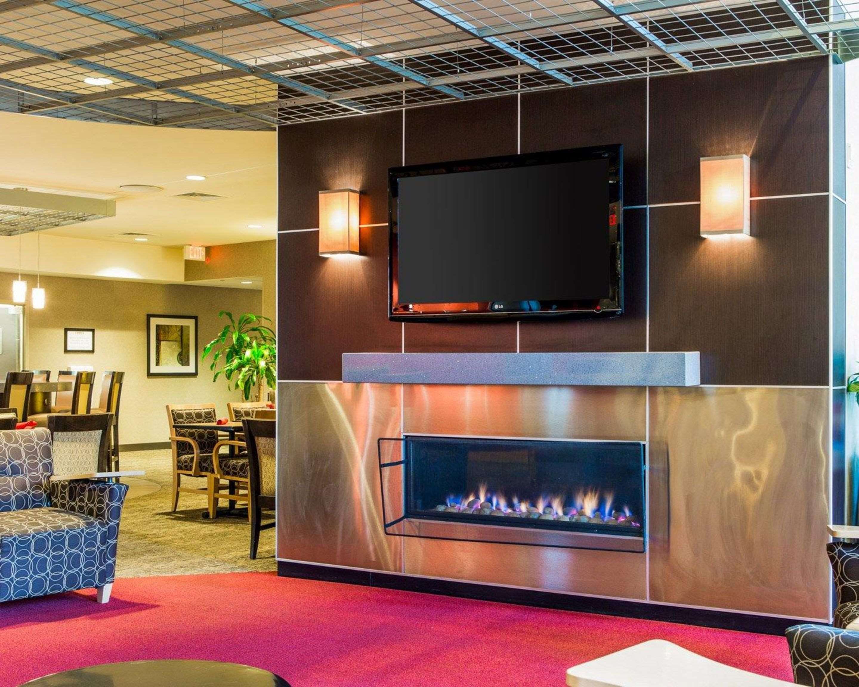 Catch up on the day in front of the large-screen media wall | Cambria Hotel Traverse City
