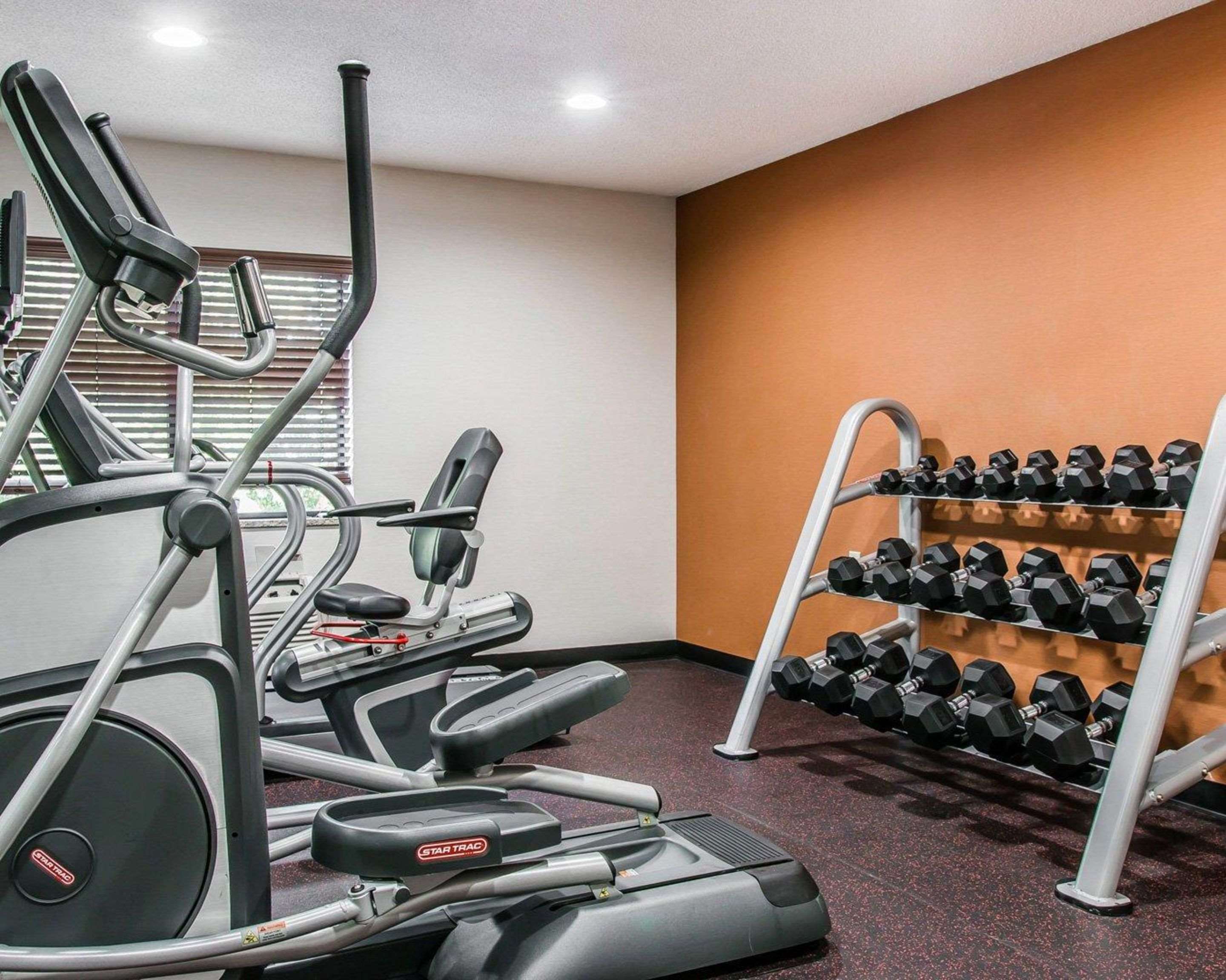Fitness center with cardio equipment and weights | Quality Inn & Suites Warren - Detroit