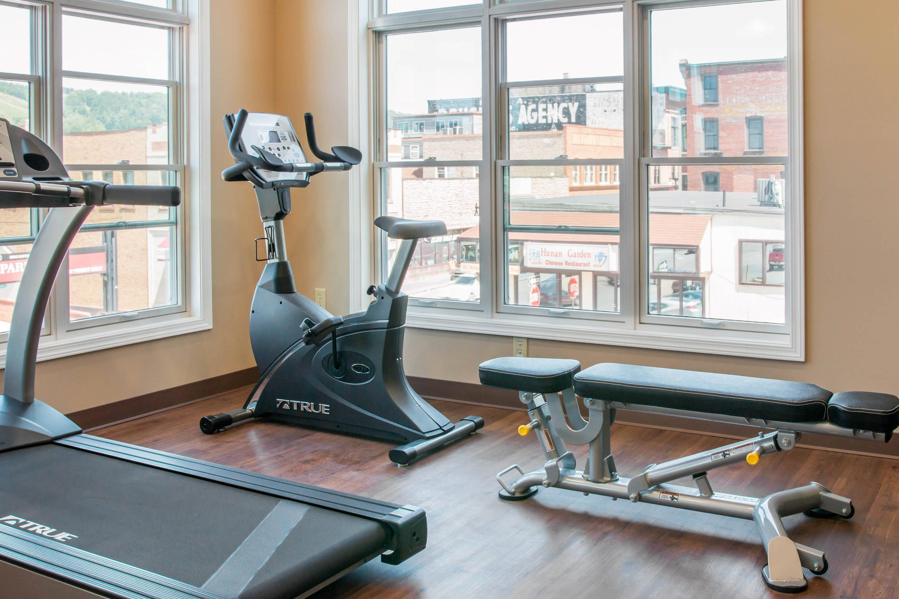 Exercise room with cardio equipment | Quality Inn & Suites Houghton Downtown